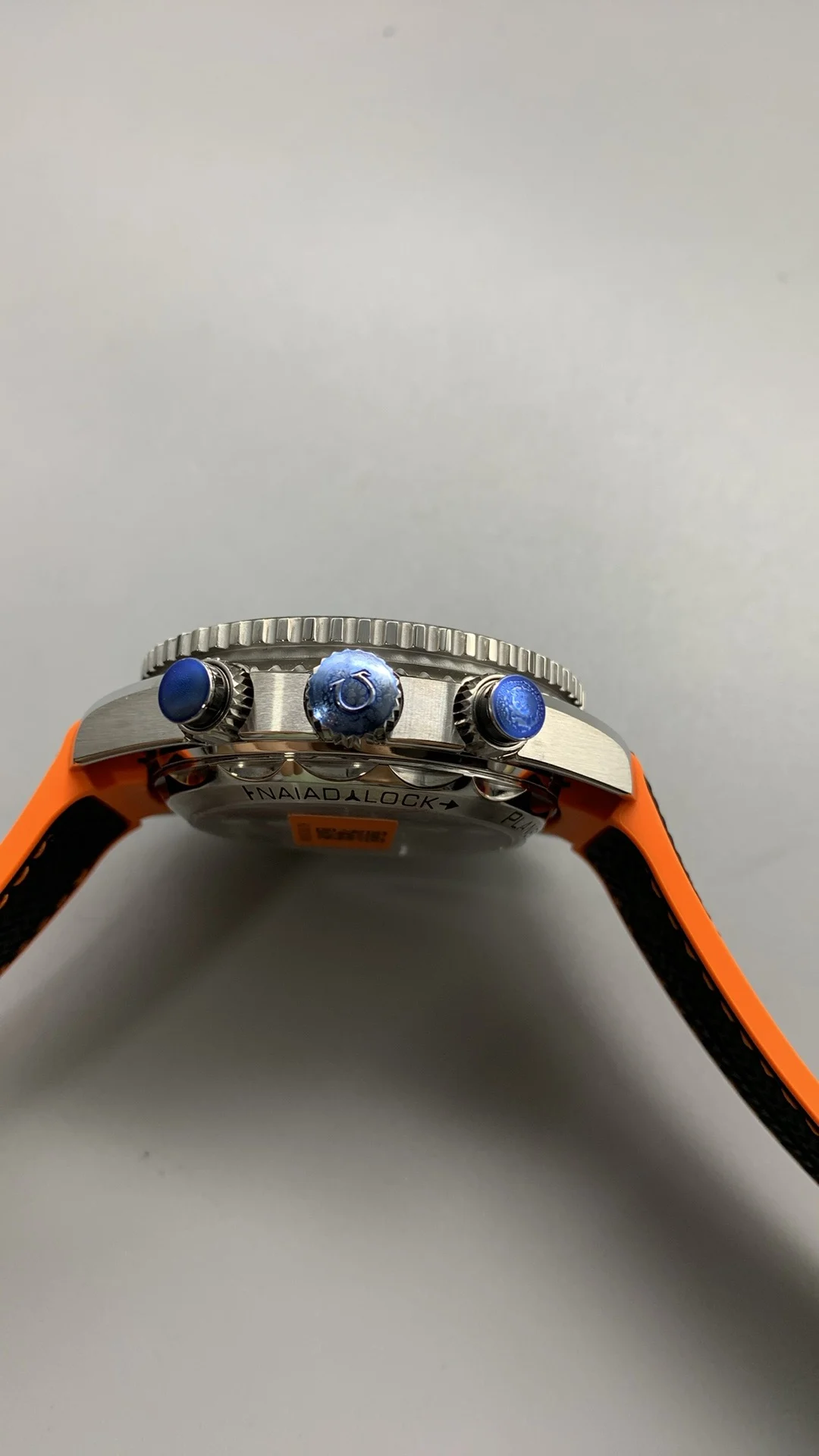 Omega Seamaster Planet Ocean Orange Dial — photographed off the sweep