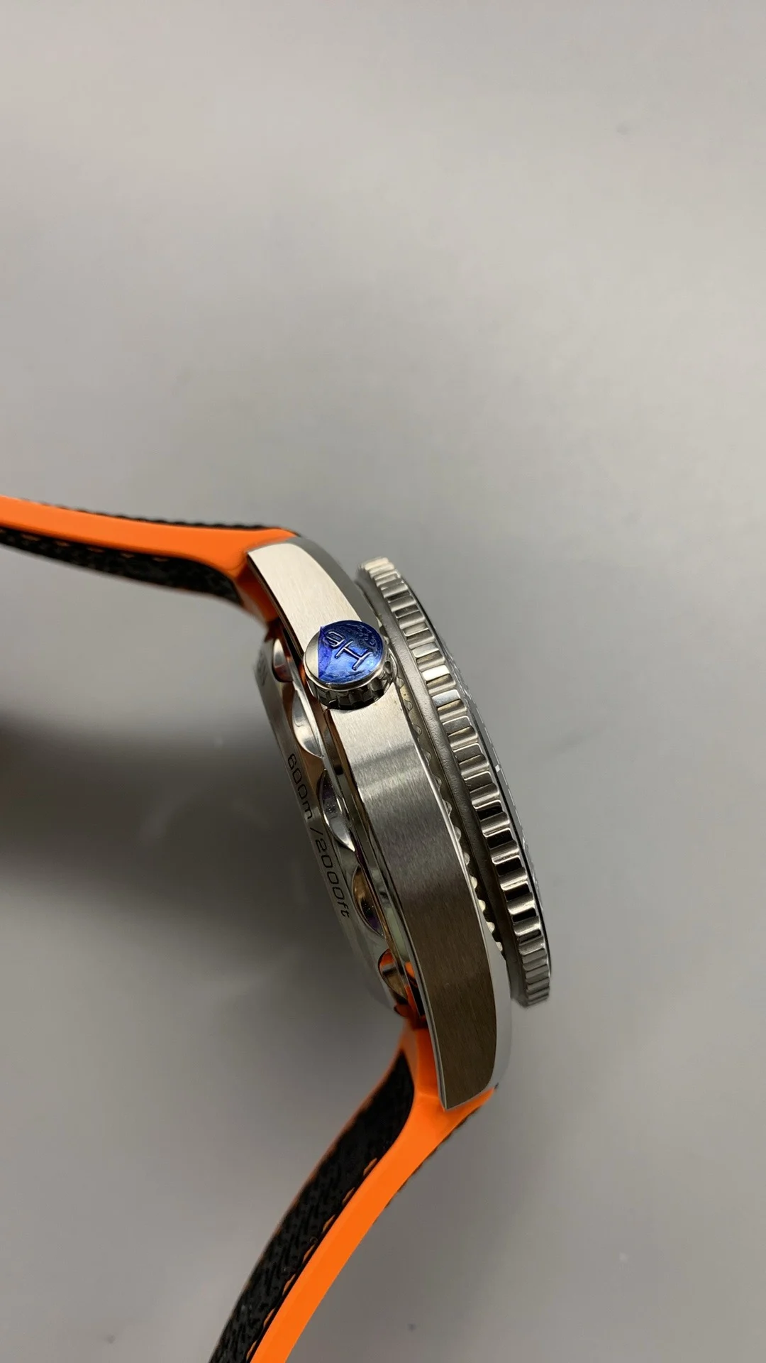 Omega Seamaster Planet Ocean Orange Dial — photographed off the sweep