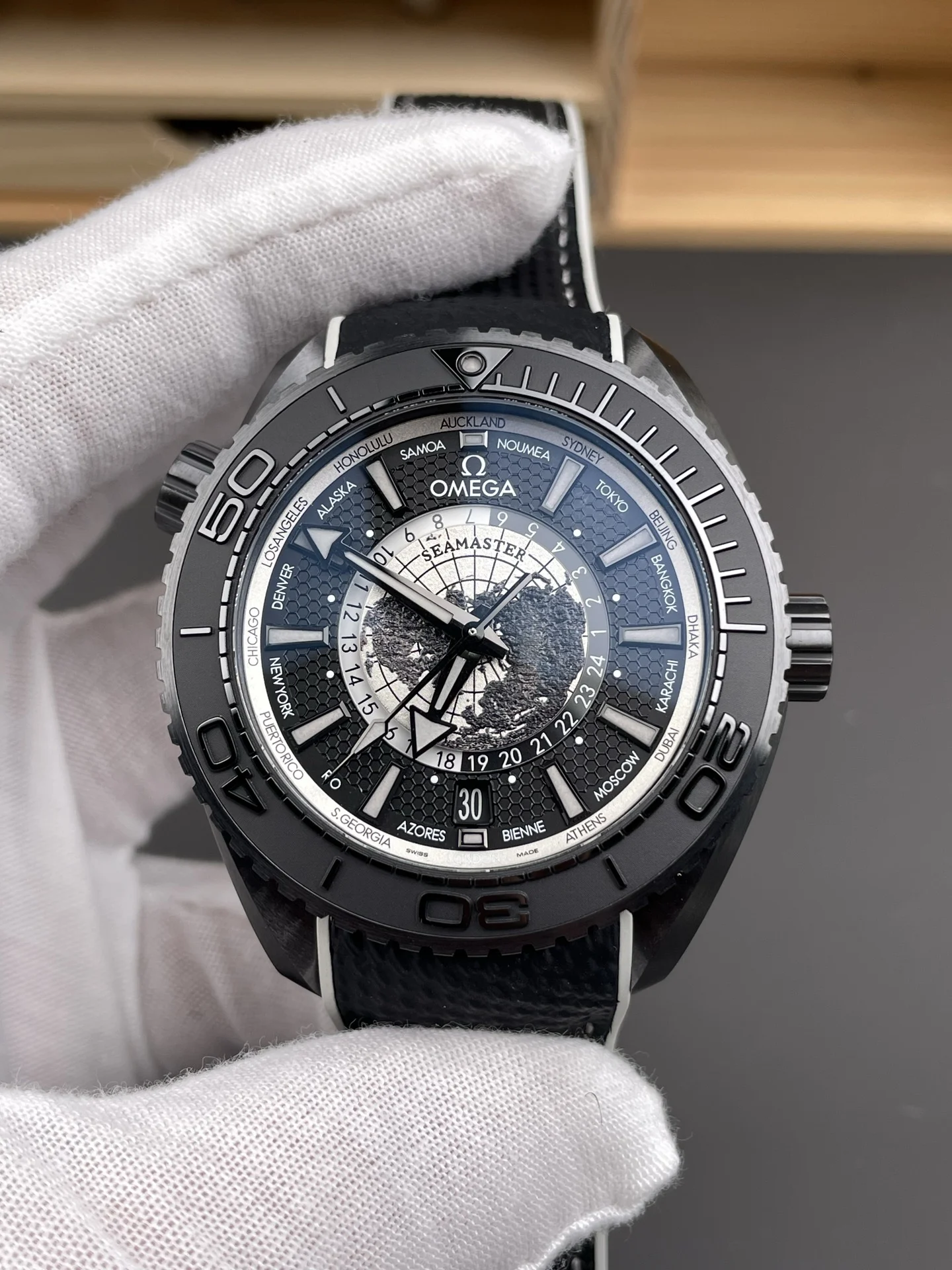 Omega Seamaster Planet Ocean World Time 45.5mm — photographed off the sweep