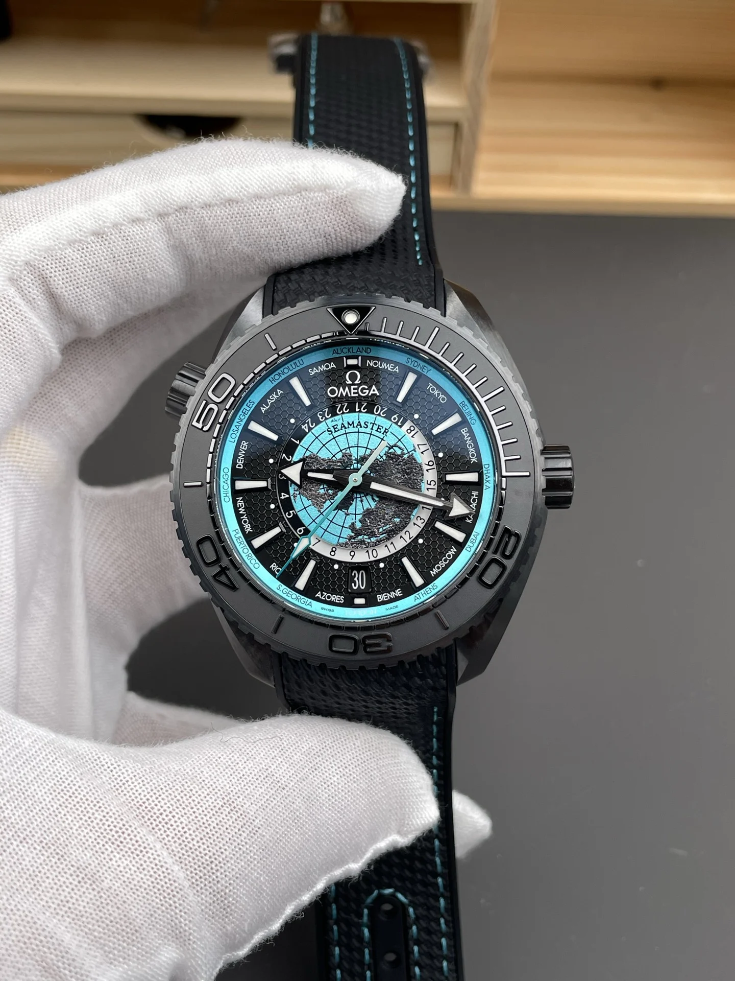 Omega Seamaster Planet Ocean World Time Tiffany — photographed off the sweep