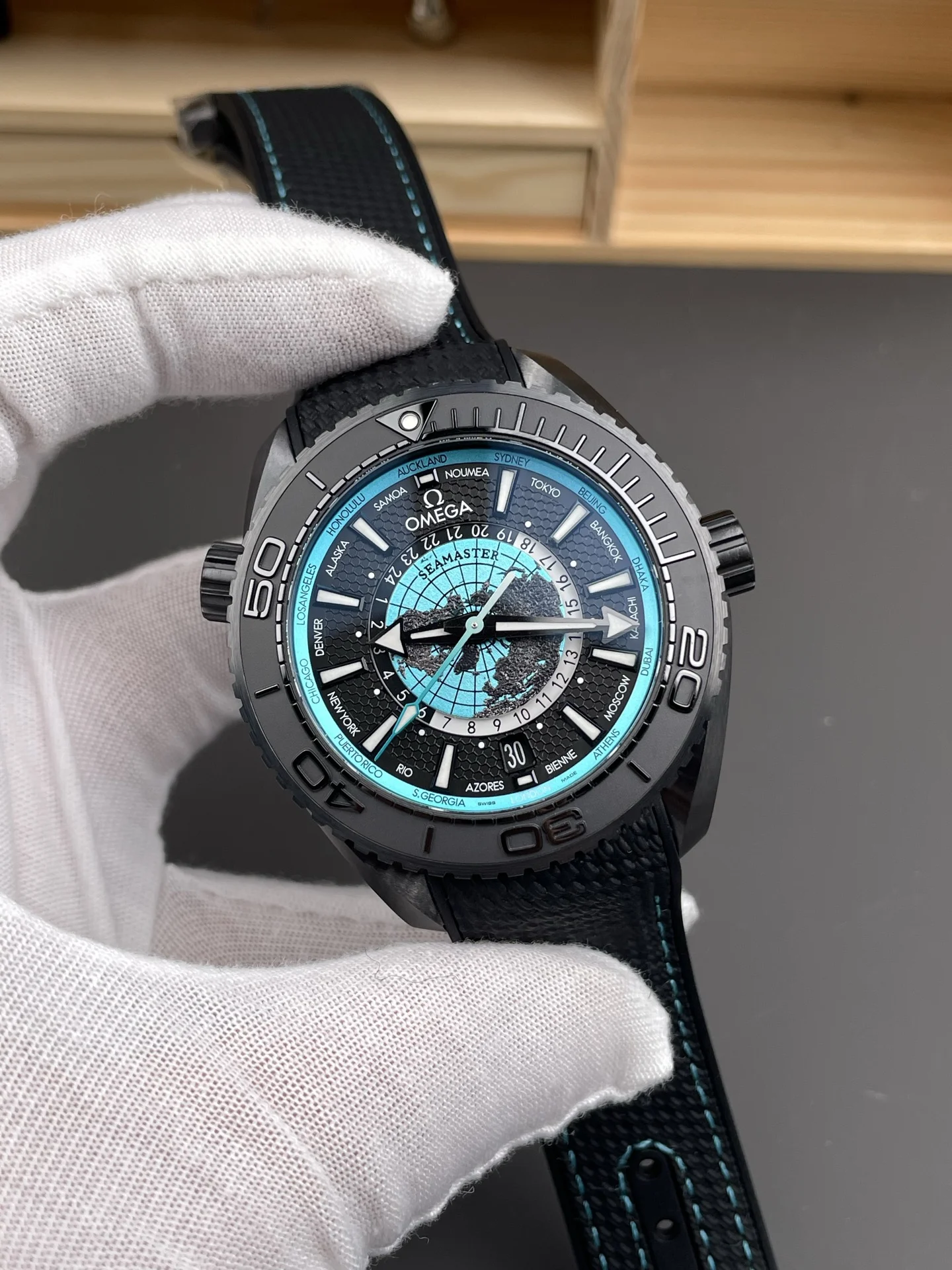 Omega Seamaster Planet Ocean World Time Tiffany — photographed off the sweep