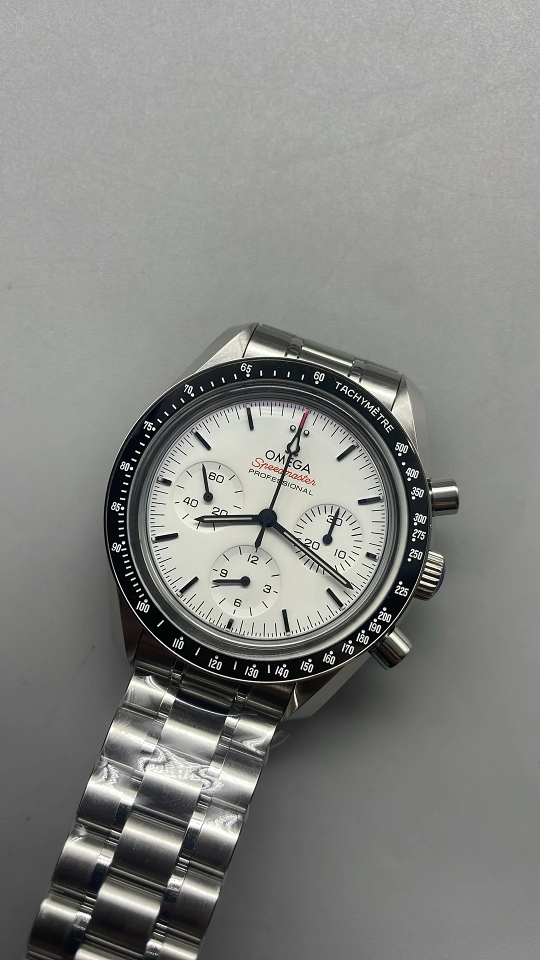 Omega Speedmaster White Dial — photographed off the sweep