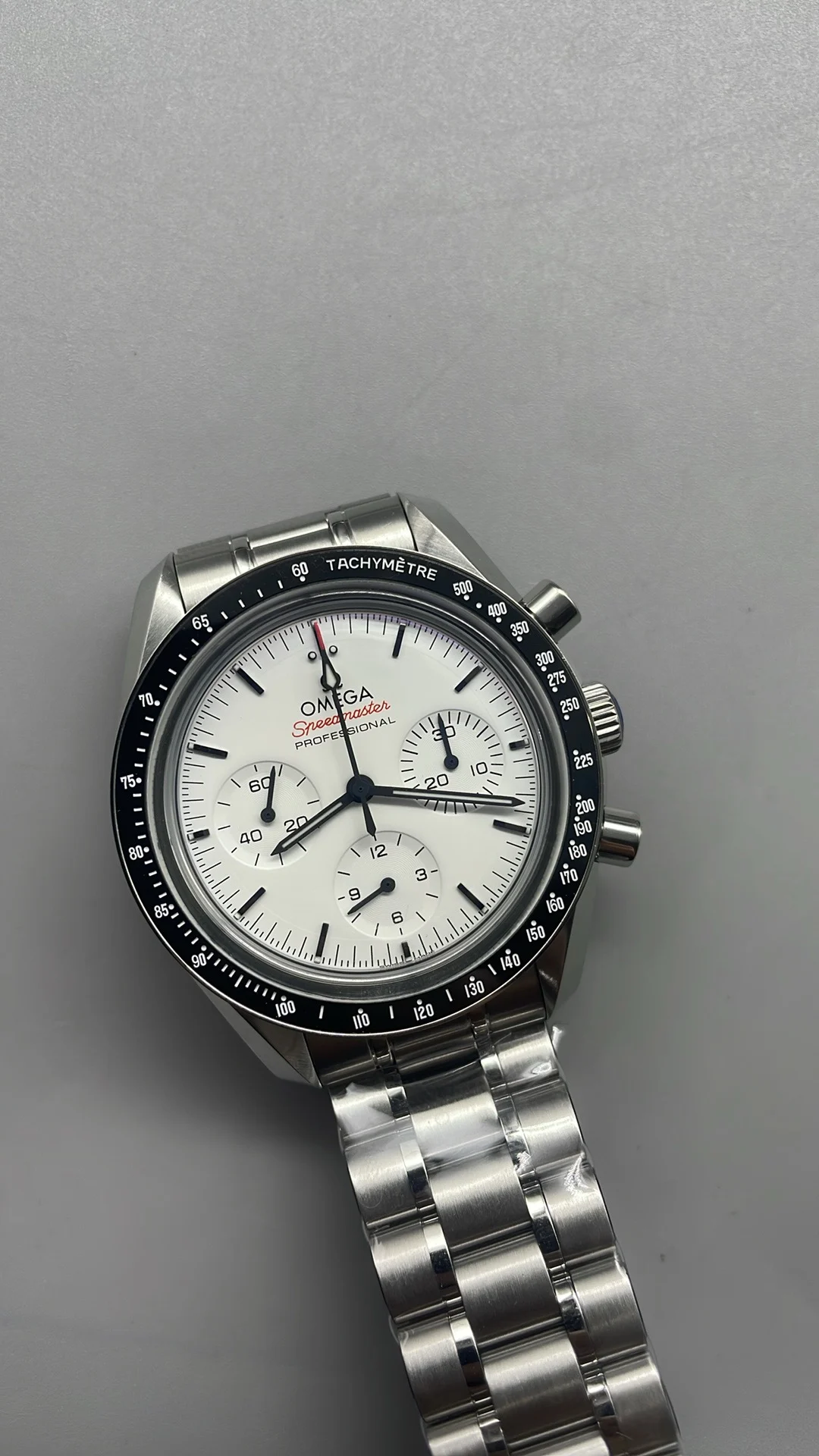 Omega Speedmaster White Dial — photographed off the sweep