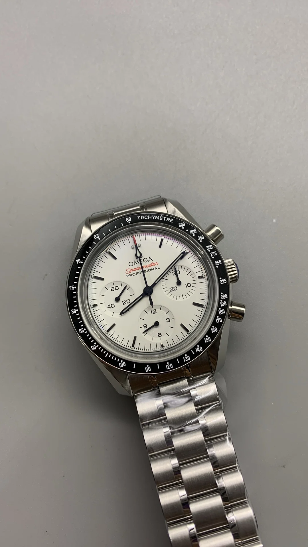 Omega Speedmaster White Dial — photographed off the sweep