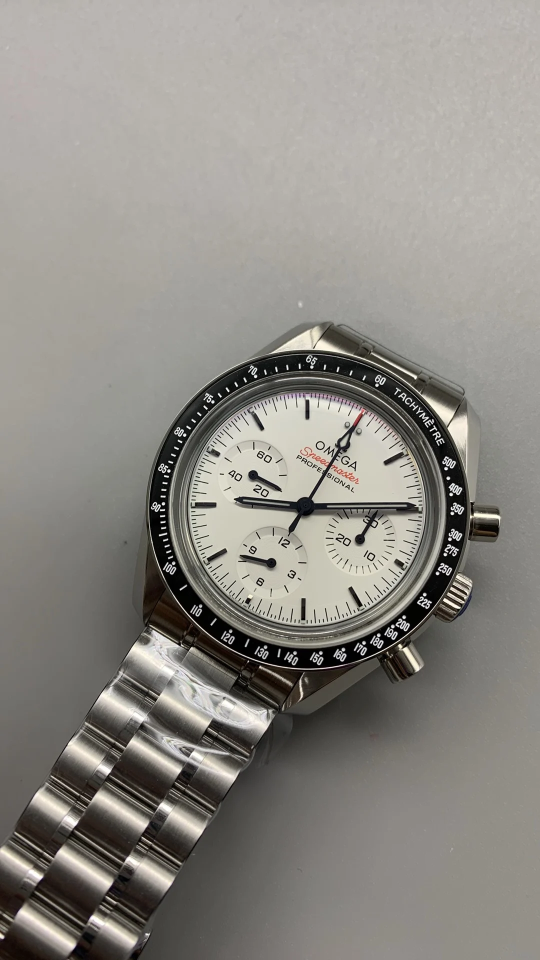 Omega Speedmaster White Dial — photographed off the sweep