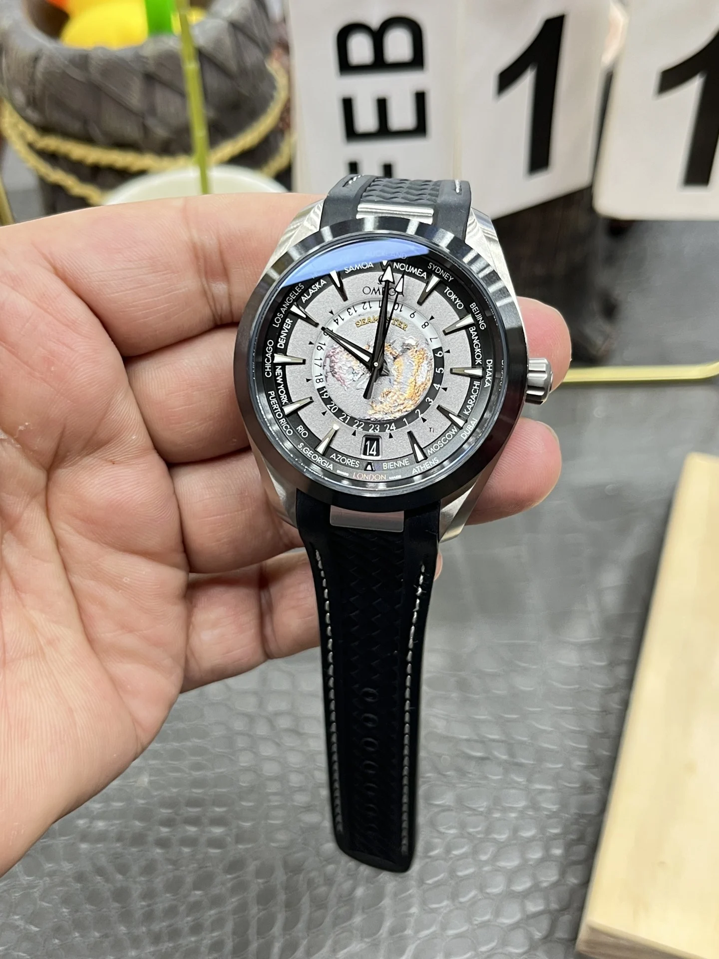 Omega World Time Ceramic — photographed off the sweep