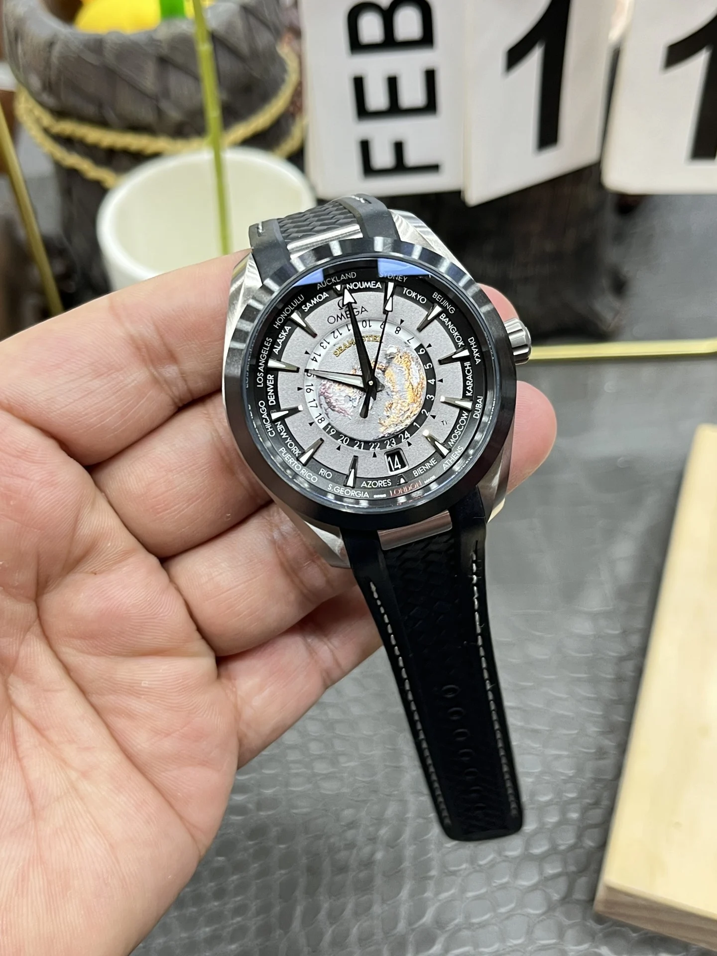 Omega World Time Ceramic — photographed off the sweep