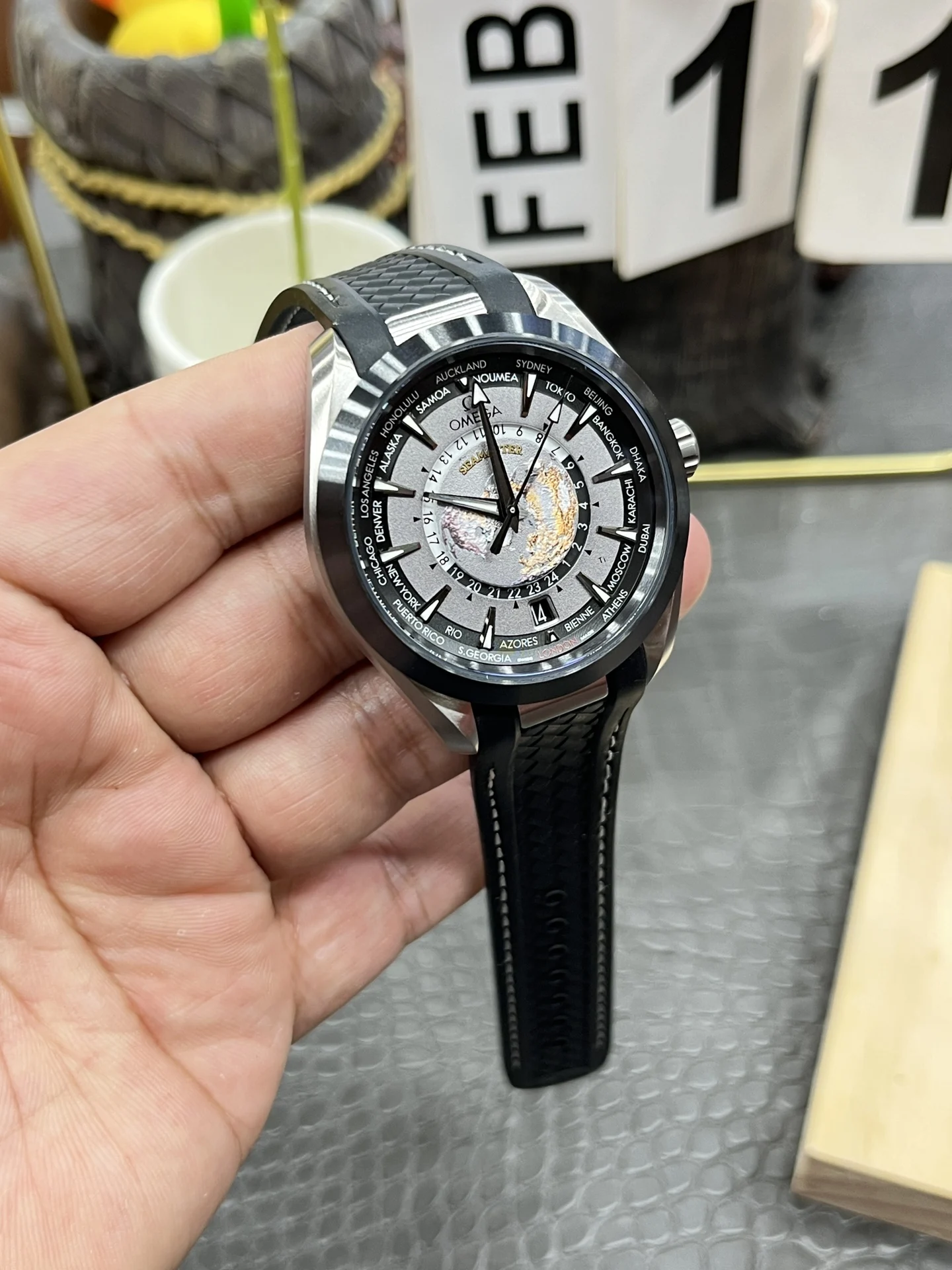 Omega World Time Ceramic — photographed off the sweep