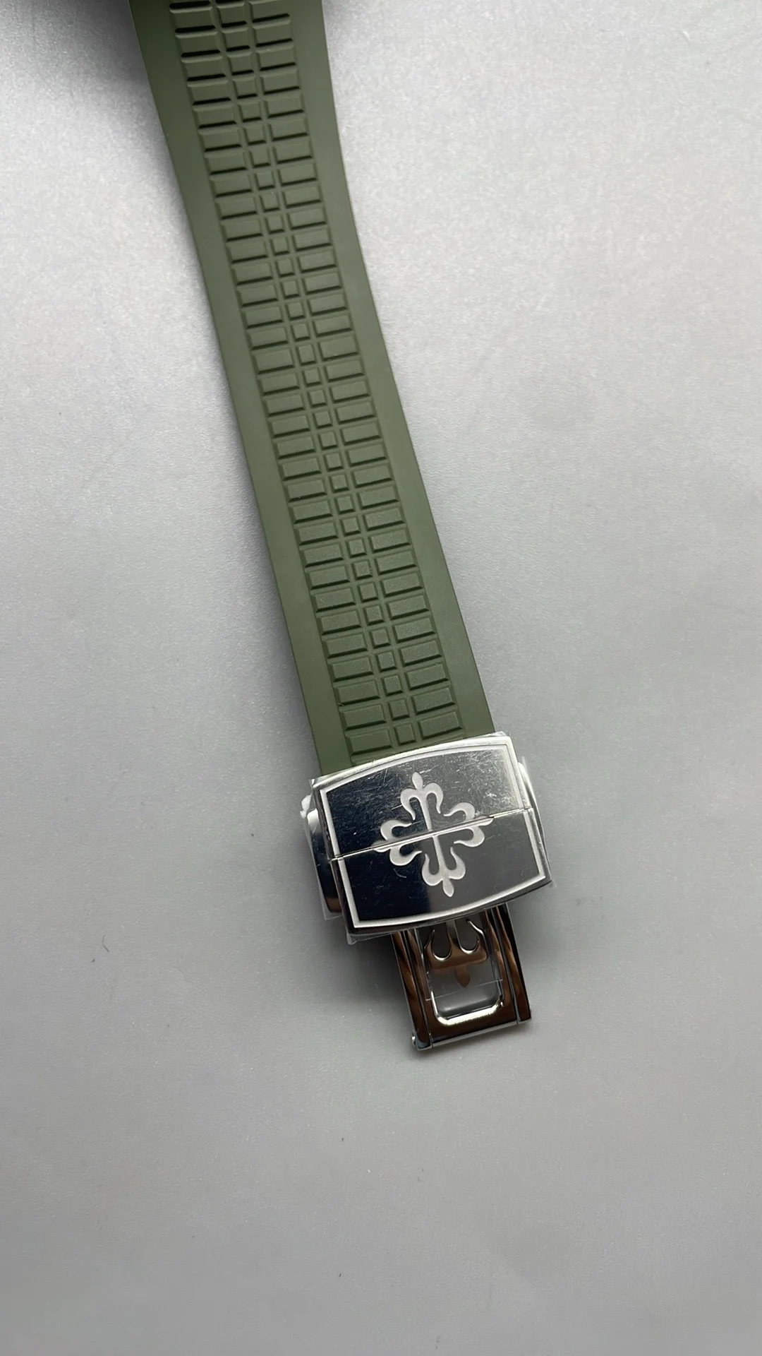 Patek Philippe Aquanaut Green Dial 5168 — photographed off the sweep