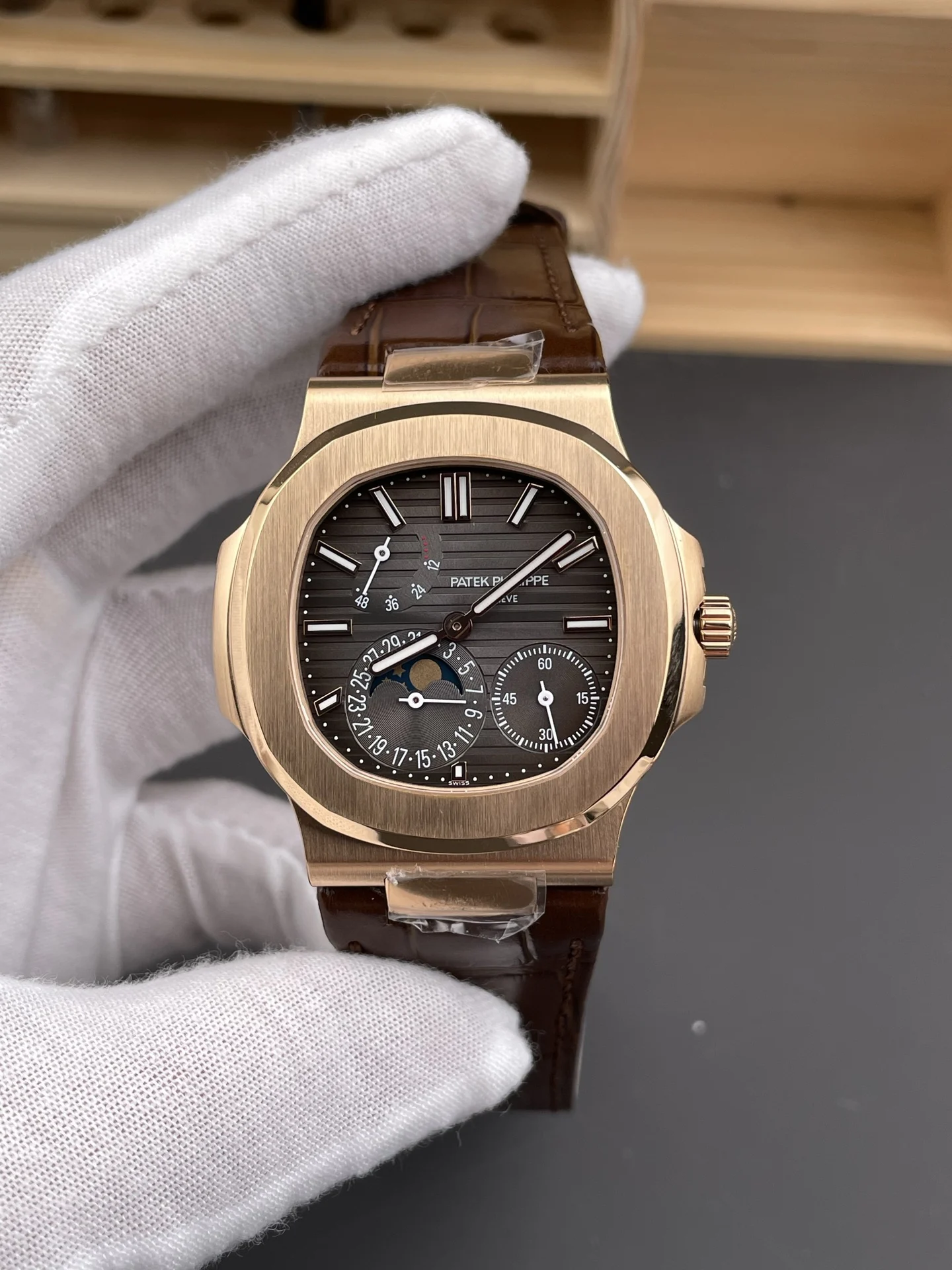 Patek Philippe Nautilus Rose Gold Black Dial 5712 40mm — photographed off the sweep