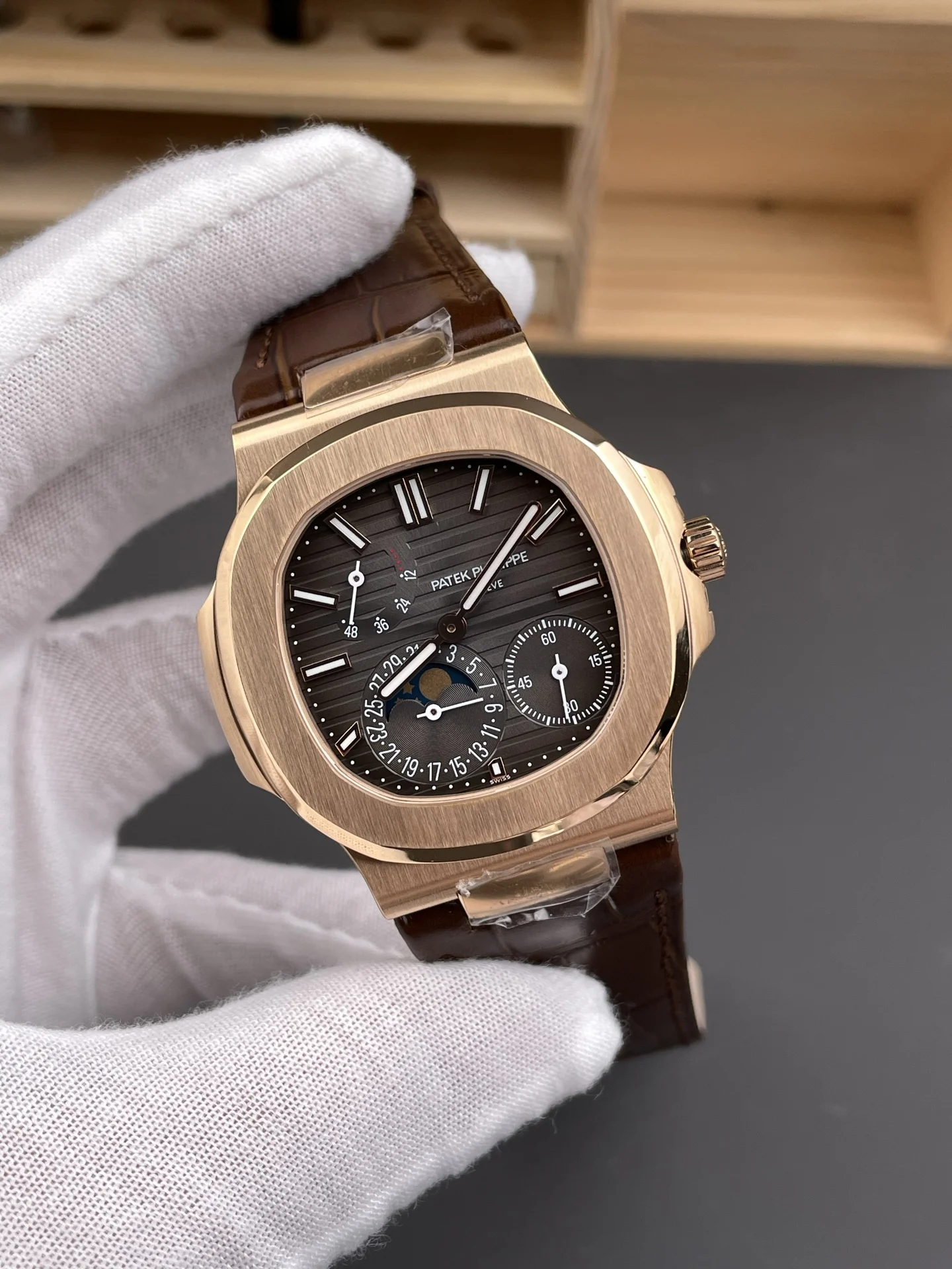 Patek Philippe Nautilus Rose Gold Black Dial 5712 40mm — photographed off the sweep