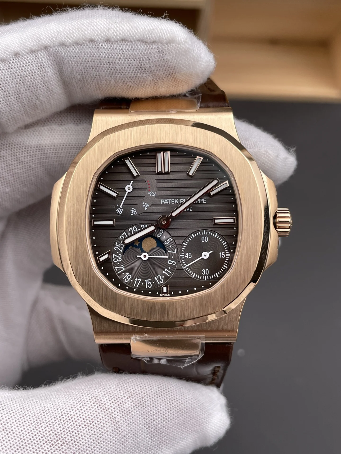 Patek Philippe Nautilus Rose Gold Black Dial 5712 40mm — photographed off the sweep