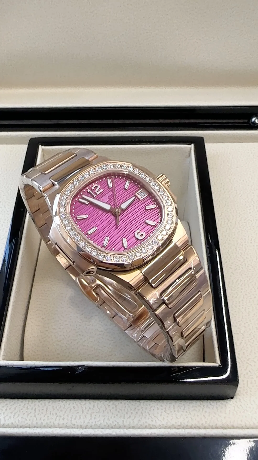 Patek Philippe Nautilus Rose Gold White Dial 7010 — photographed off the sweep