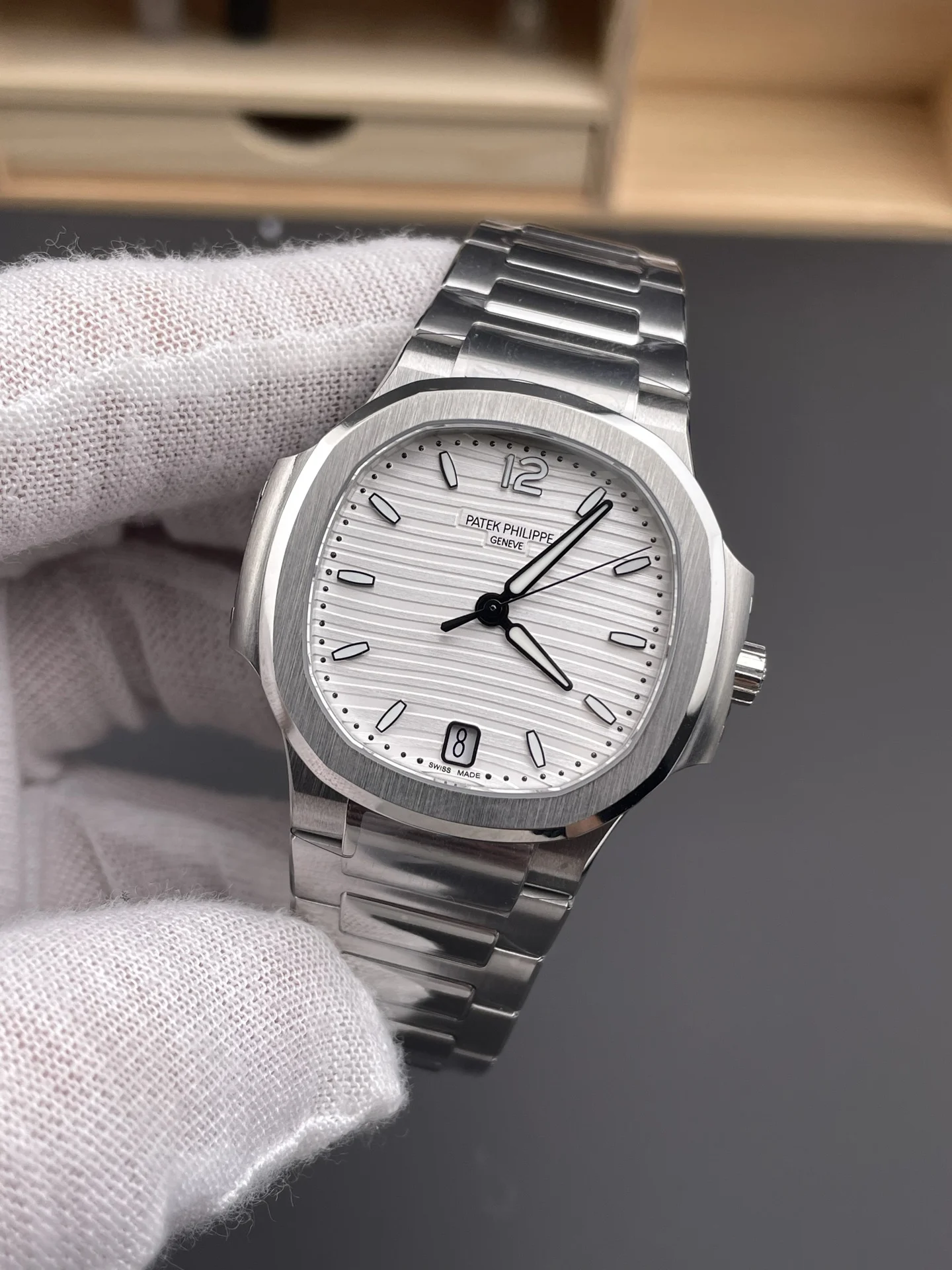 Patek Philippe Nautilus White Dial 7118 — photographed off the sweep