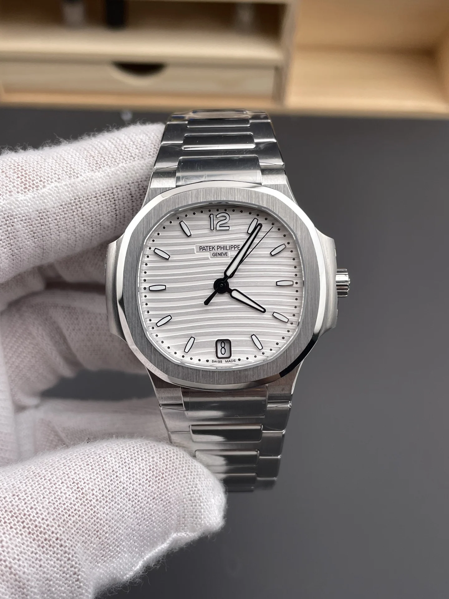 Patek Philippe Nautilus White Dial 7118 — photographed off the sweep