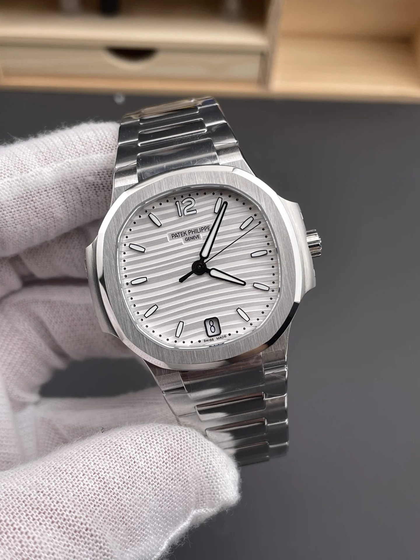 Patek Philippe Nautilus White Dial 7118 — photographed off the sweep