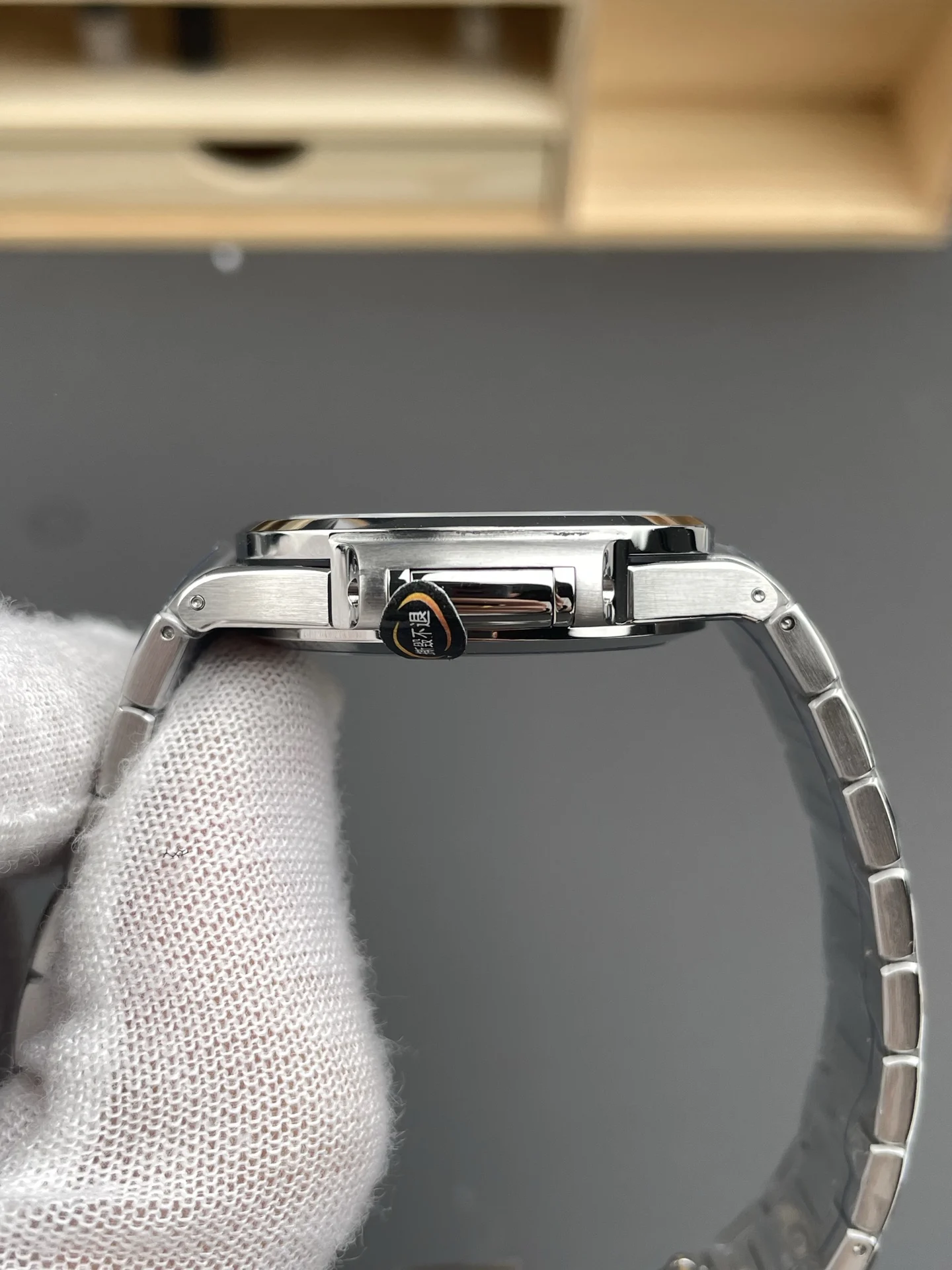 Patek Philippe Nautilus White Dial 7118 — photographed off the sweep