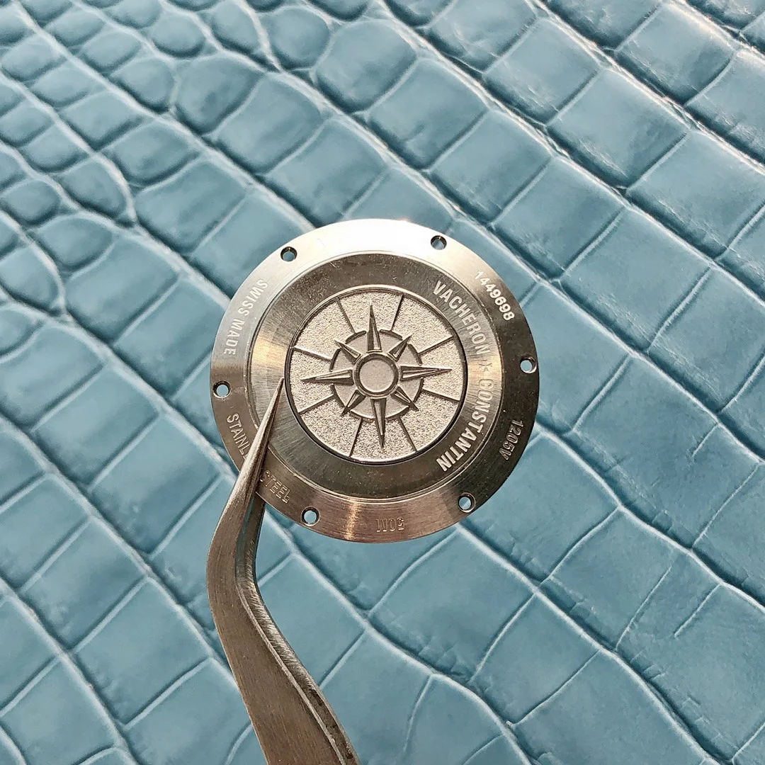 Professional disassembly to examine the parts and movement details — photographed off the sweep