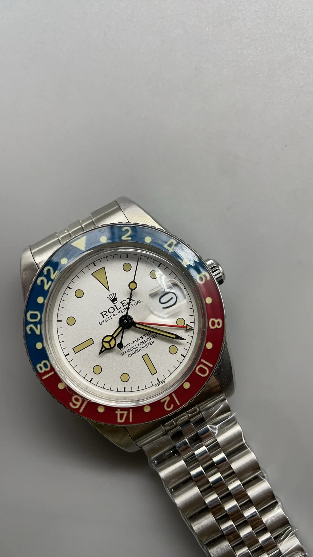 Retro, GMT, Coke white plate — photographed off the sweep