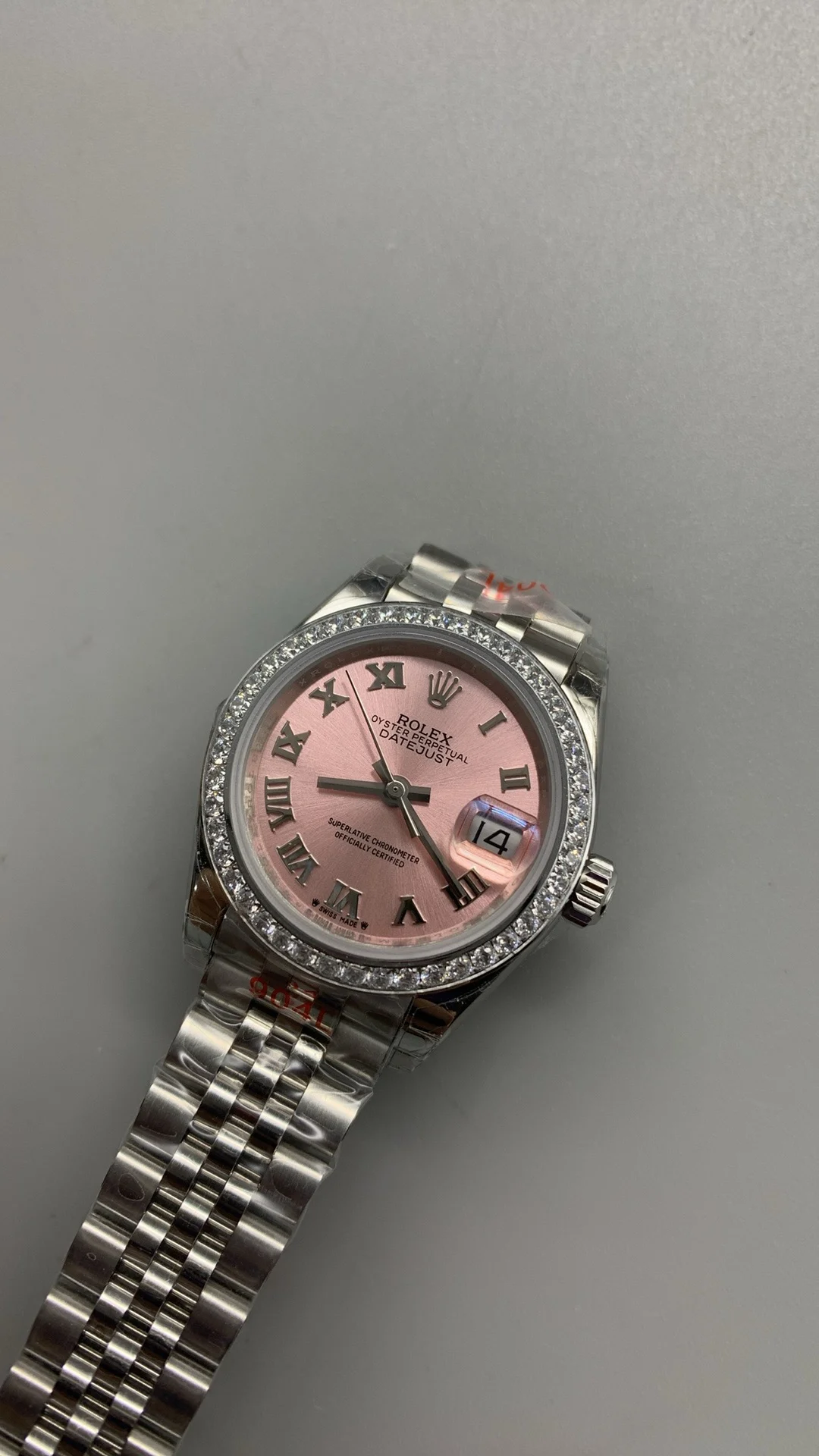 Rolex Datejust Pink Dial Diamond-Set 28mm — photographed off the sweep