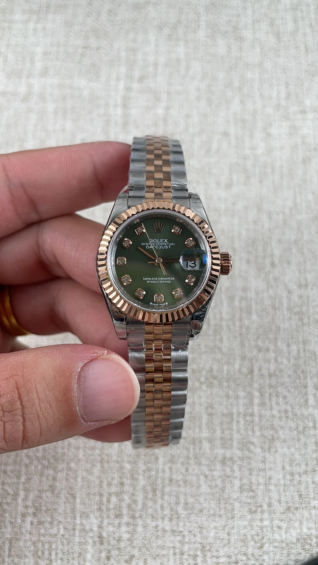 Rolex Datejust Rose Gold Green Dial 28mm — photographed off the sweep