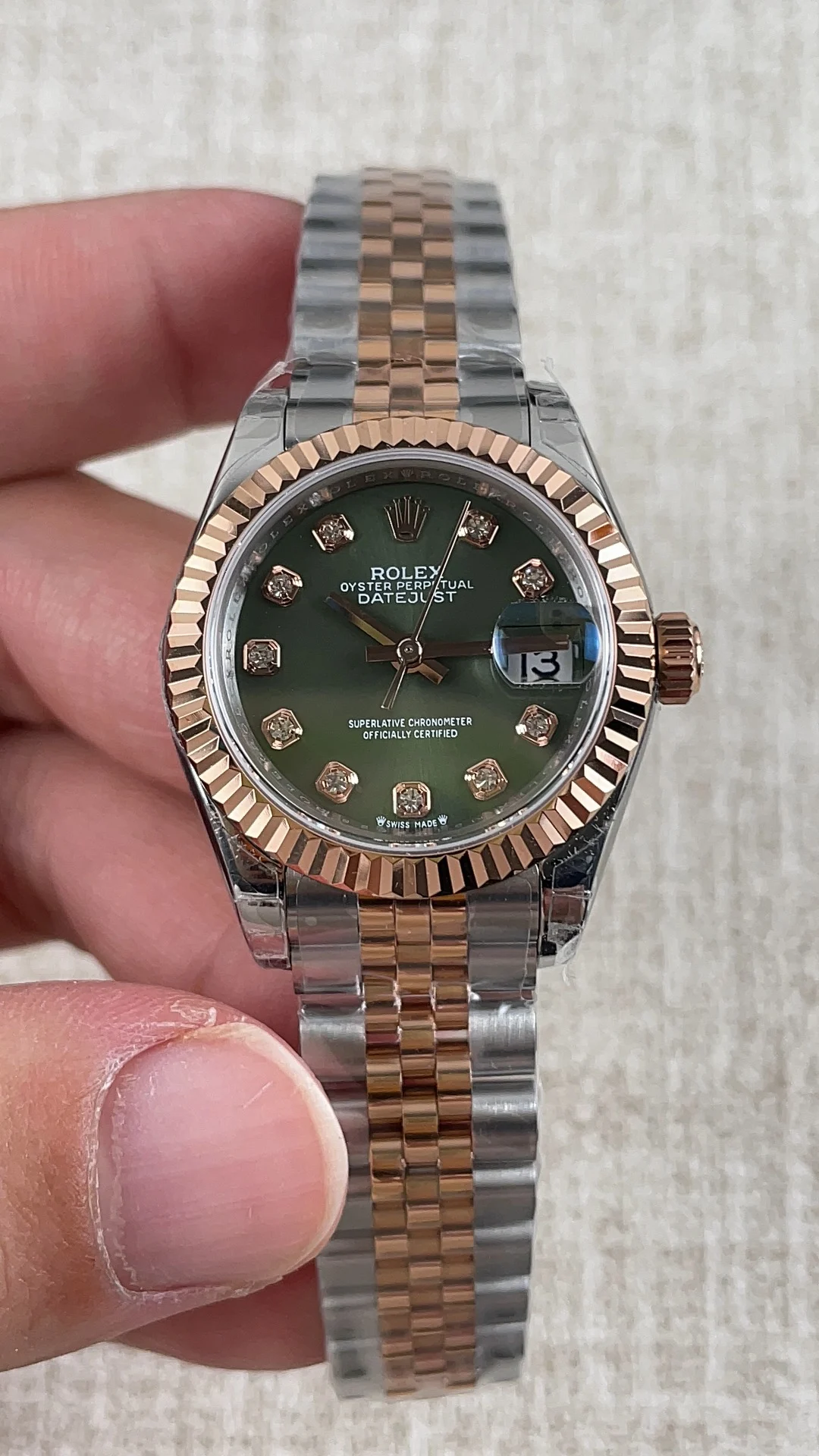 Rolex Datejust Rose Gold Green Dial 28mm — photographed off the sweep