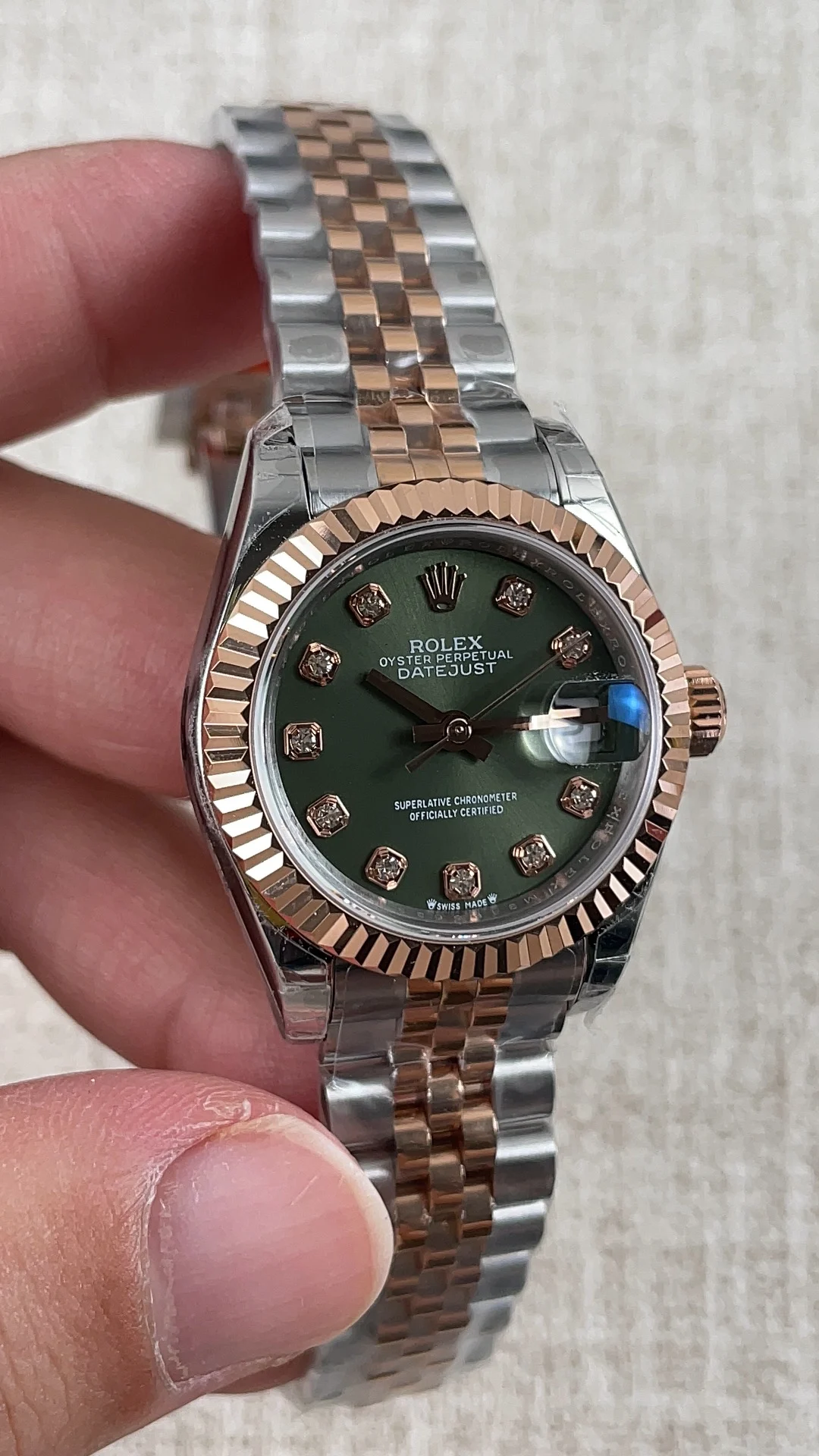 Rolex Datejust Rose Gold Green Dial 28mm — photographed off the sweep