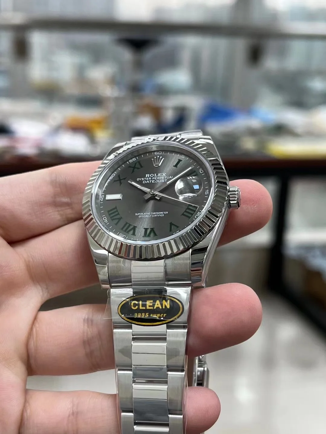 Rolex Datejust Steel Green Dial — photographed off the sweep