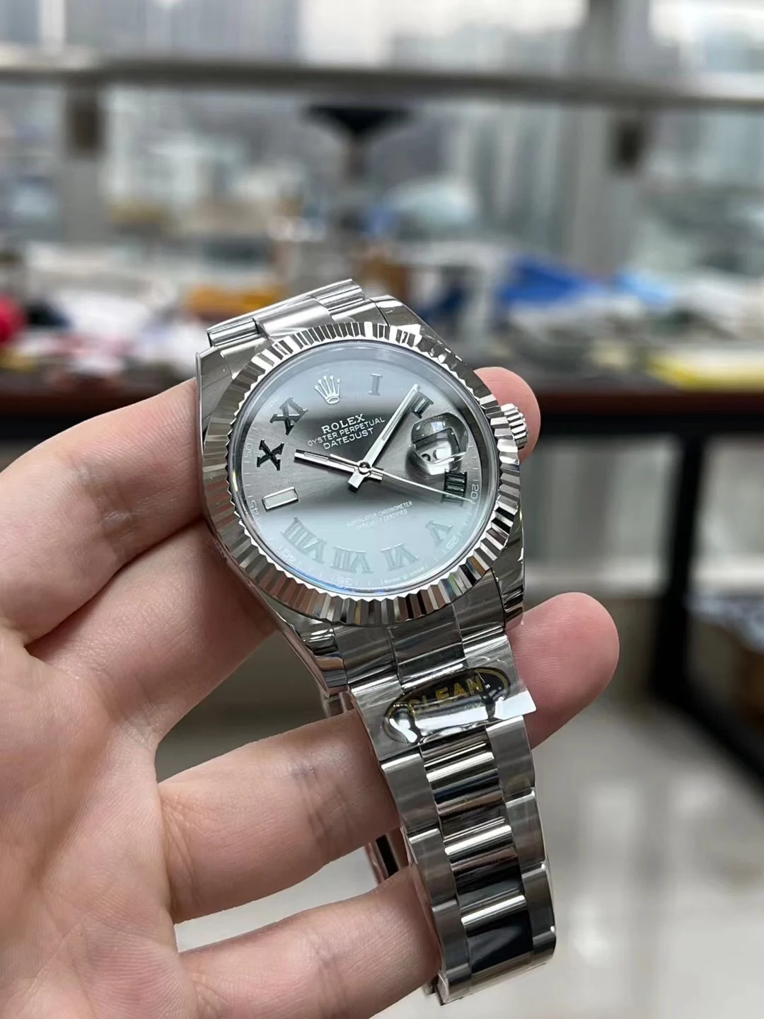 Rolex Datejust Steel Green Dial — photographed off the sweep