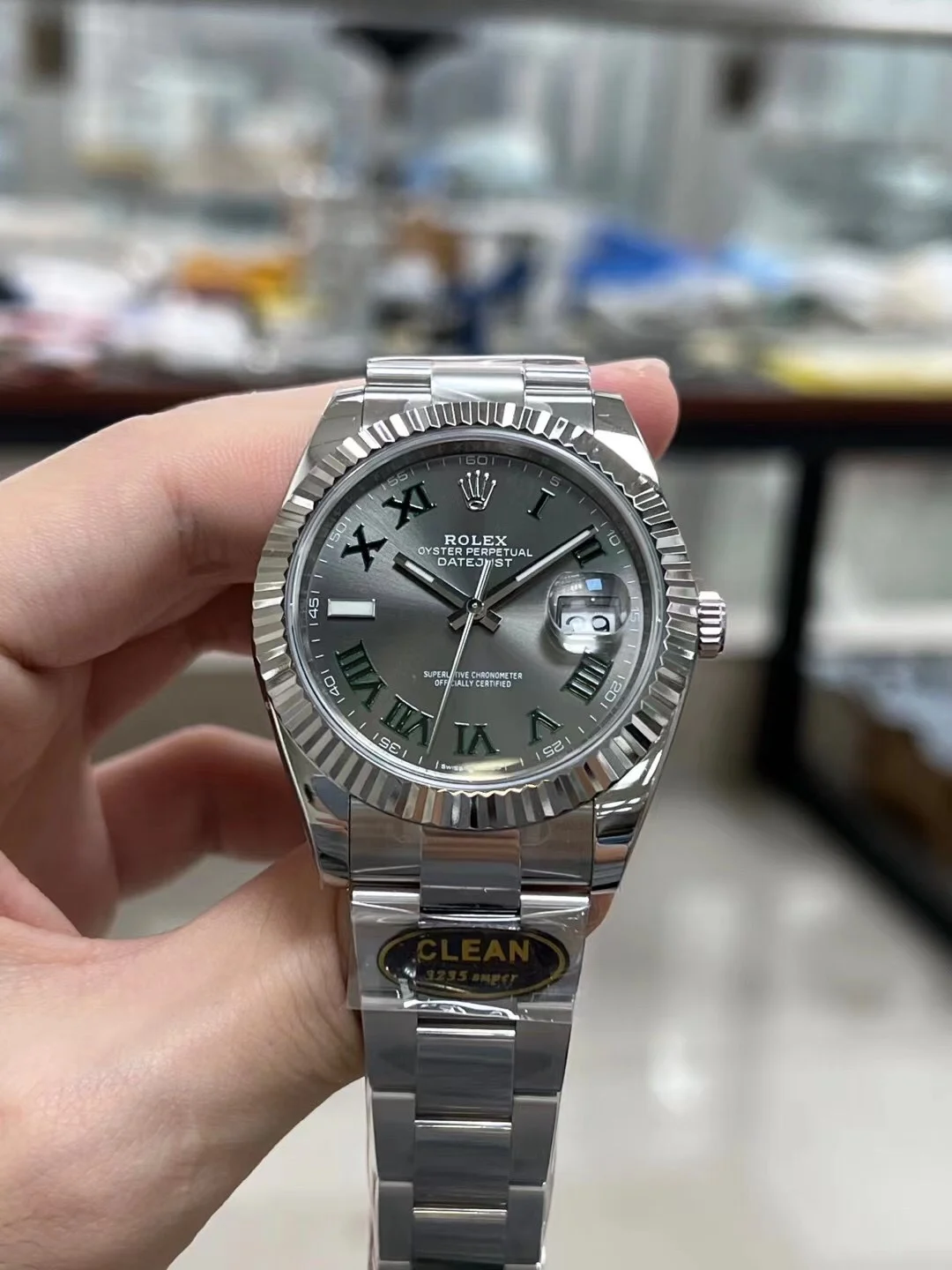 Rolex Datejust Steel Green Dial — photographed off the sweep
