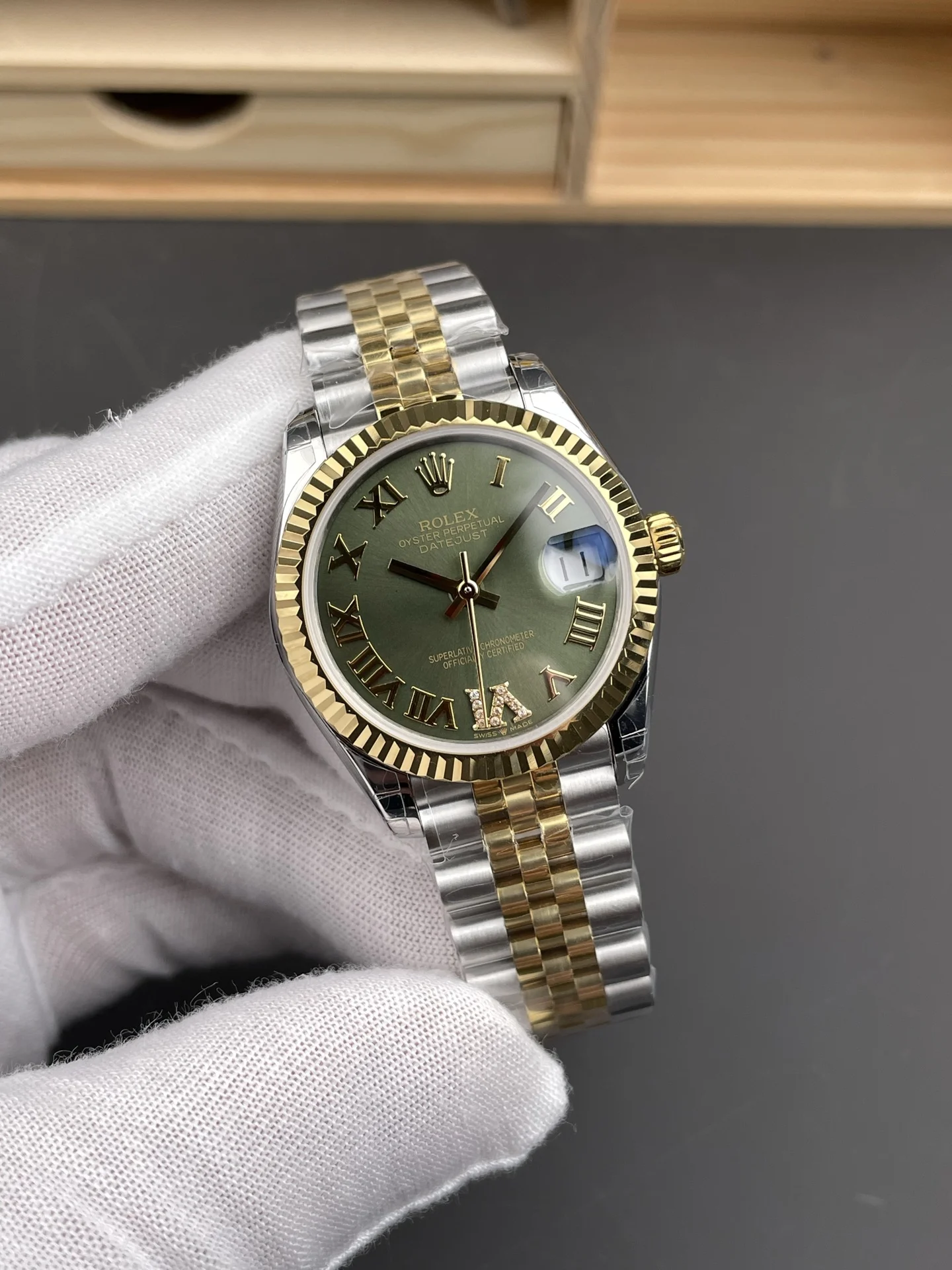 Rolex Datejust Two-Tone Green Dial 31mm — photographed off the sweep
