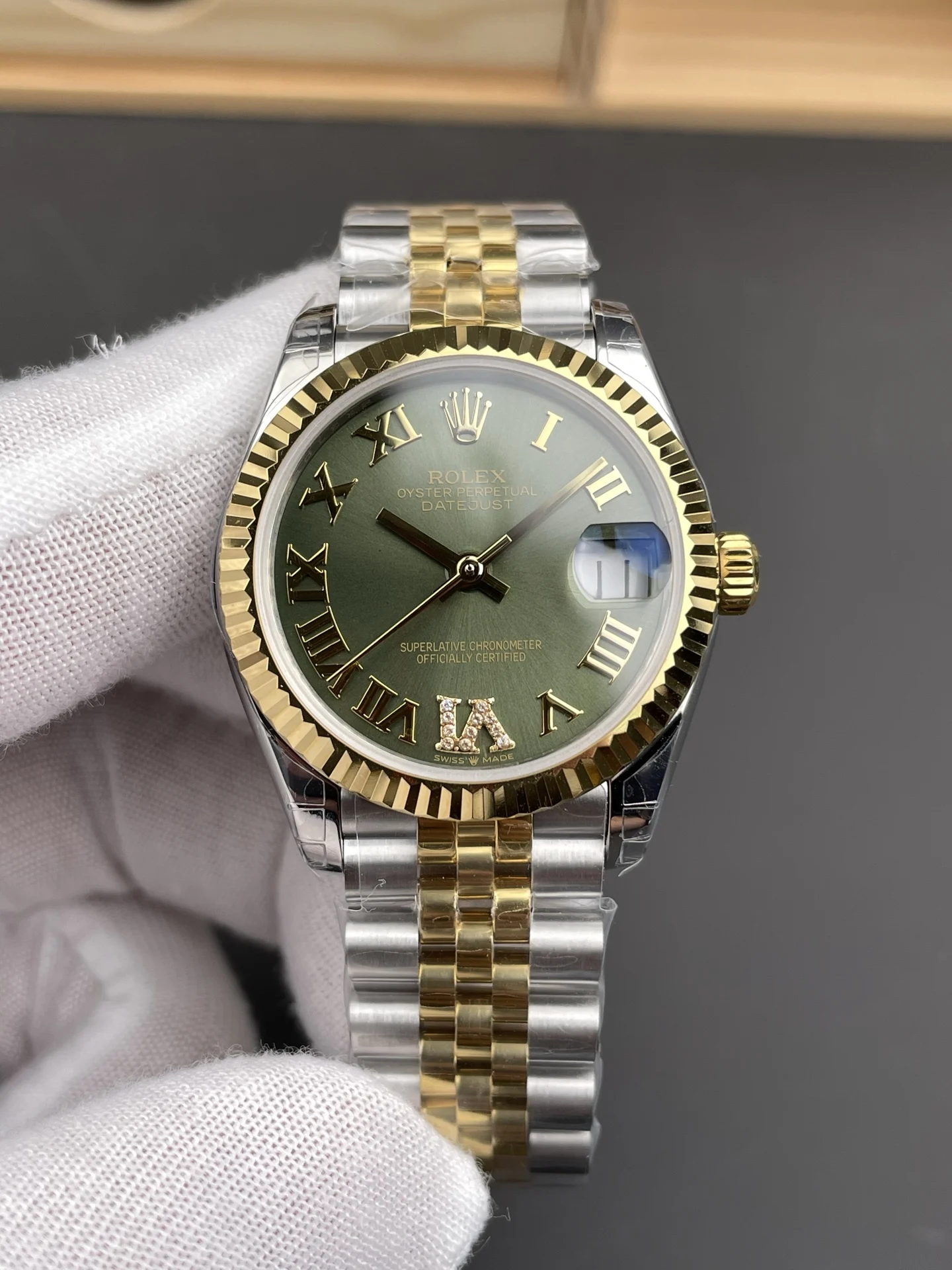 Rolex Datejust Two-Tone Green Dial 31mm — photographed off the sweep