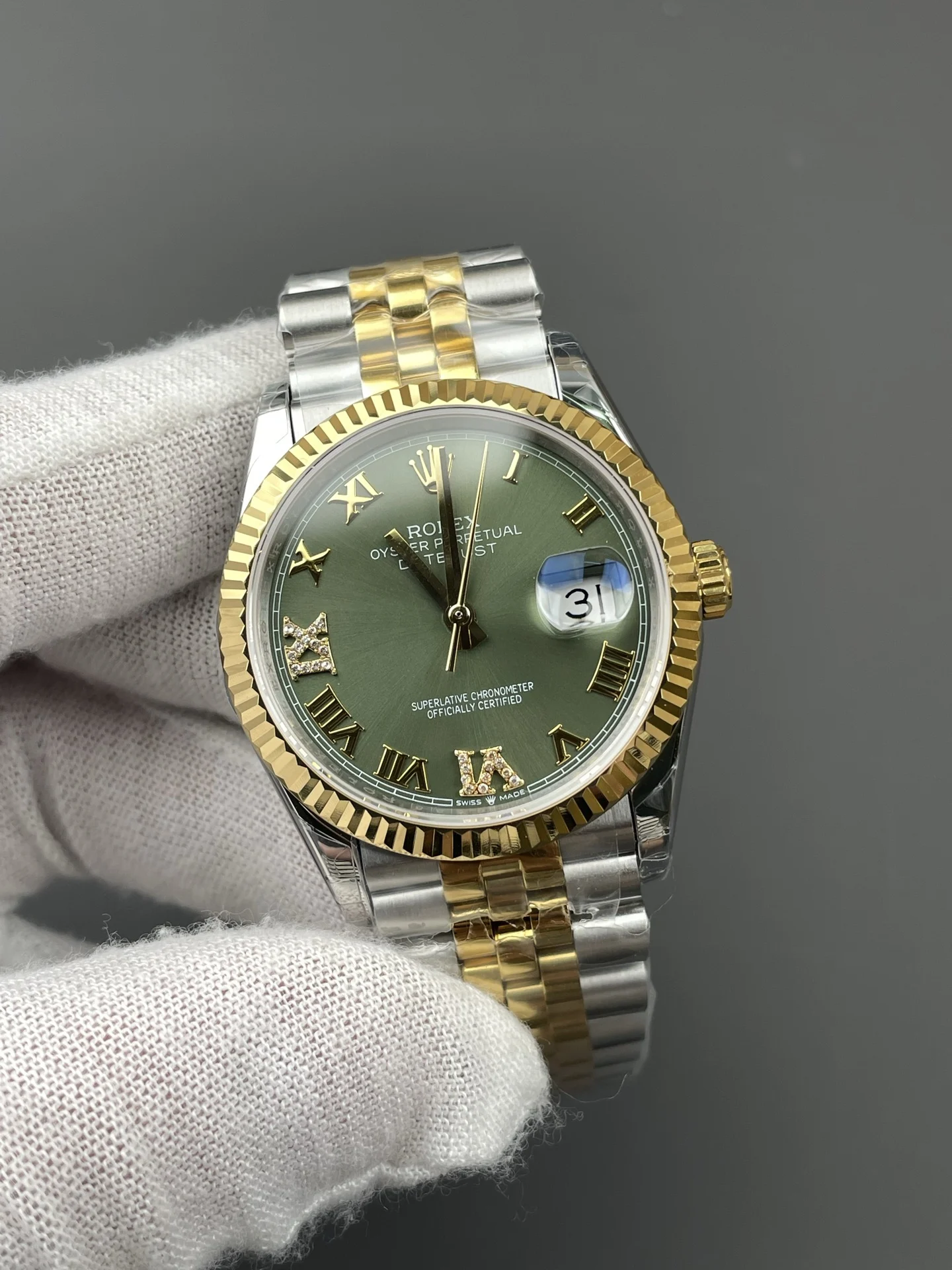 Rolex Datejust Two-Tone Green Dial 36mm — photographed off the sweep