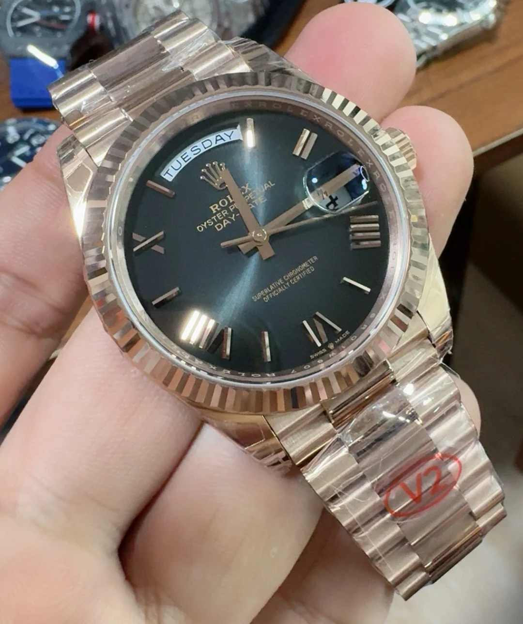 Rolex Day-Date Rose Gold Black Dial 40mm — photographed off the sweep