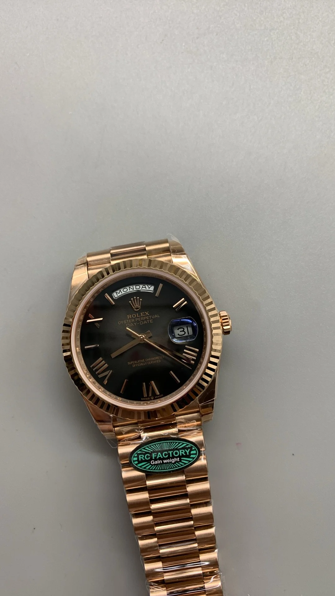 Rolex Day-Date Rose Gold Black Dial 40mm — photographed off the sweep