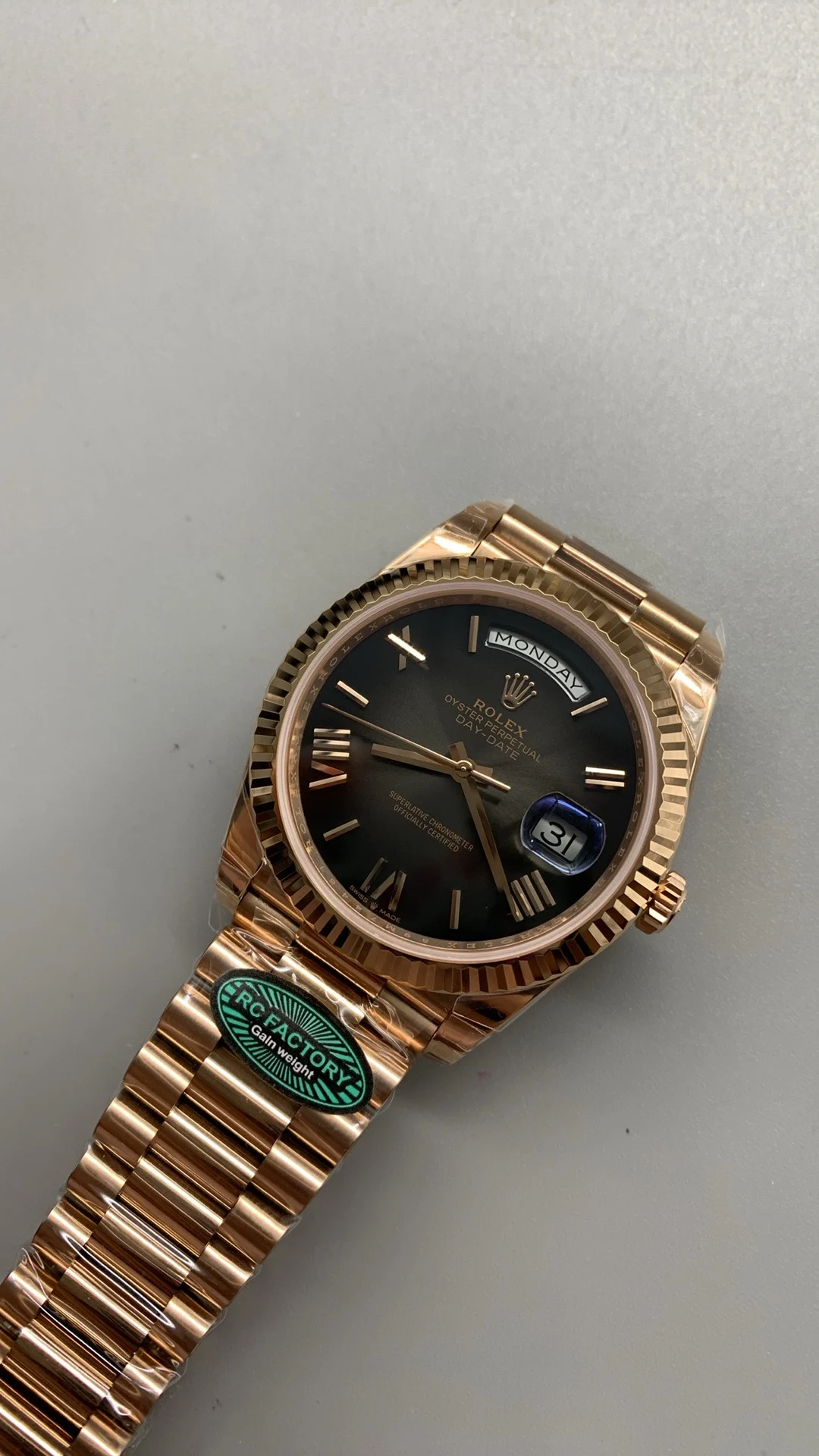 Rolex Day-Date Rose Gold Black Dial 40mm — photographed off the sweep