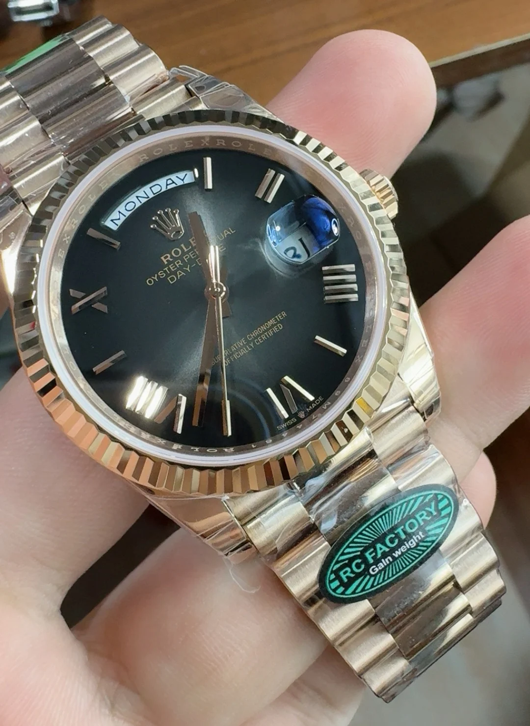 Rolex Day-Date Rose Gold Black Dial 40mm — photographed off the sweep