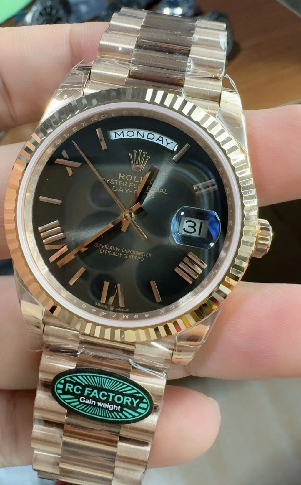 Rolex Day-Date Rose Gold Black Dial 40mm — photographed off the sweep