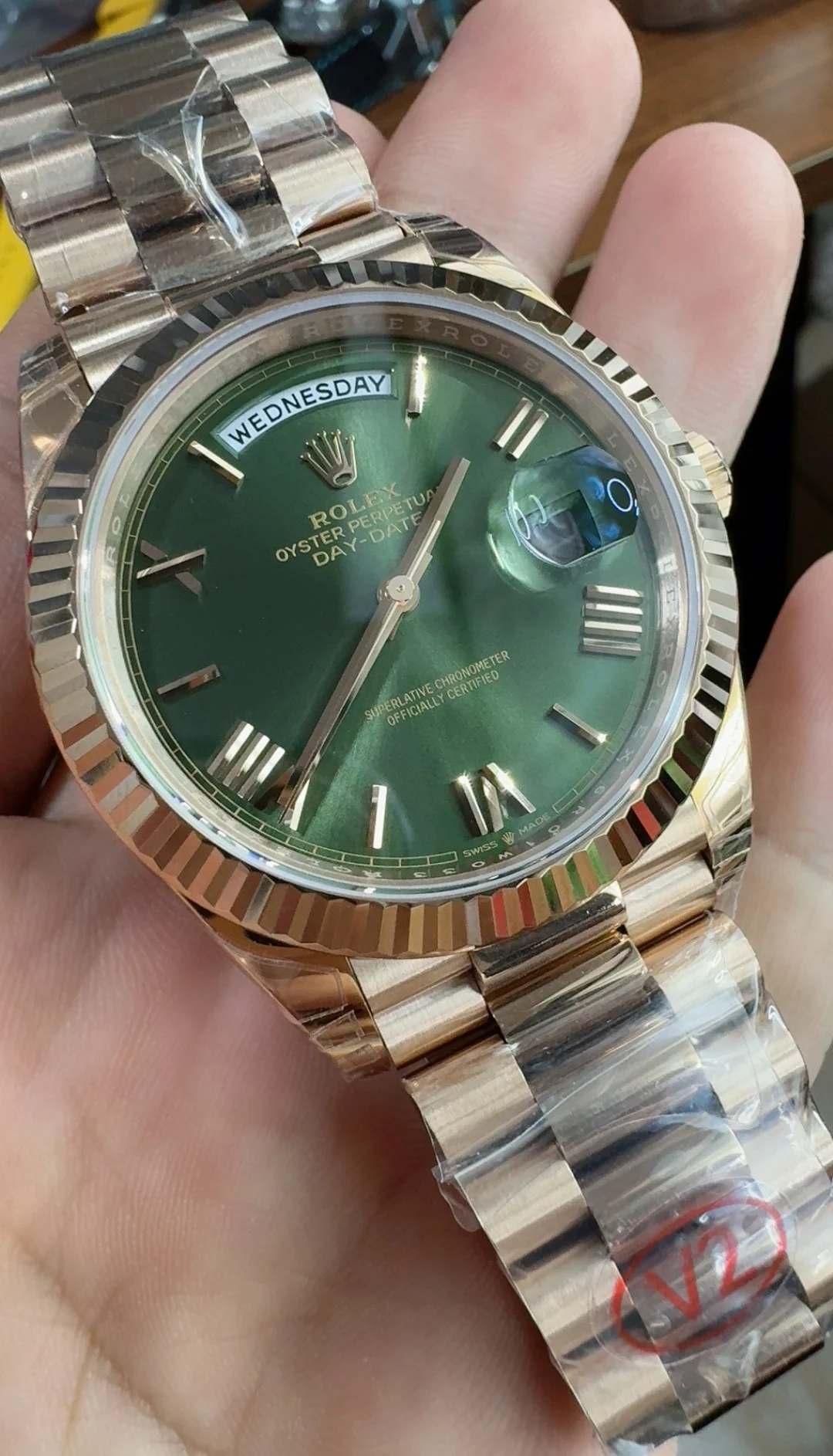 Rolex Day-Date Rose Gold Green Dial 40mm — photographed off the sweep