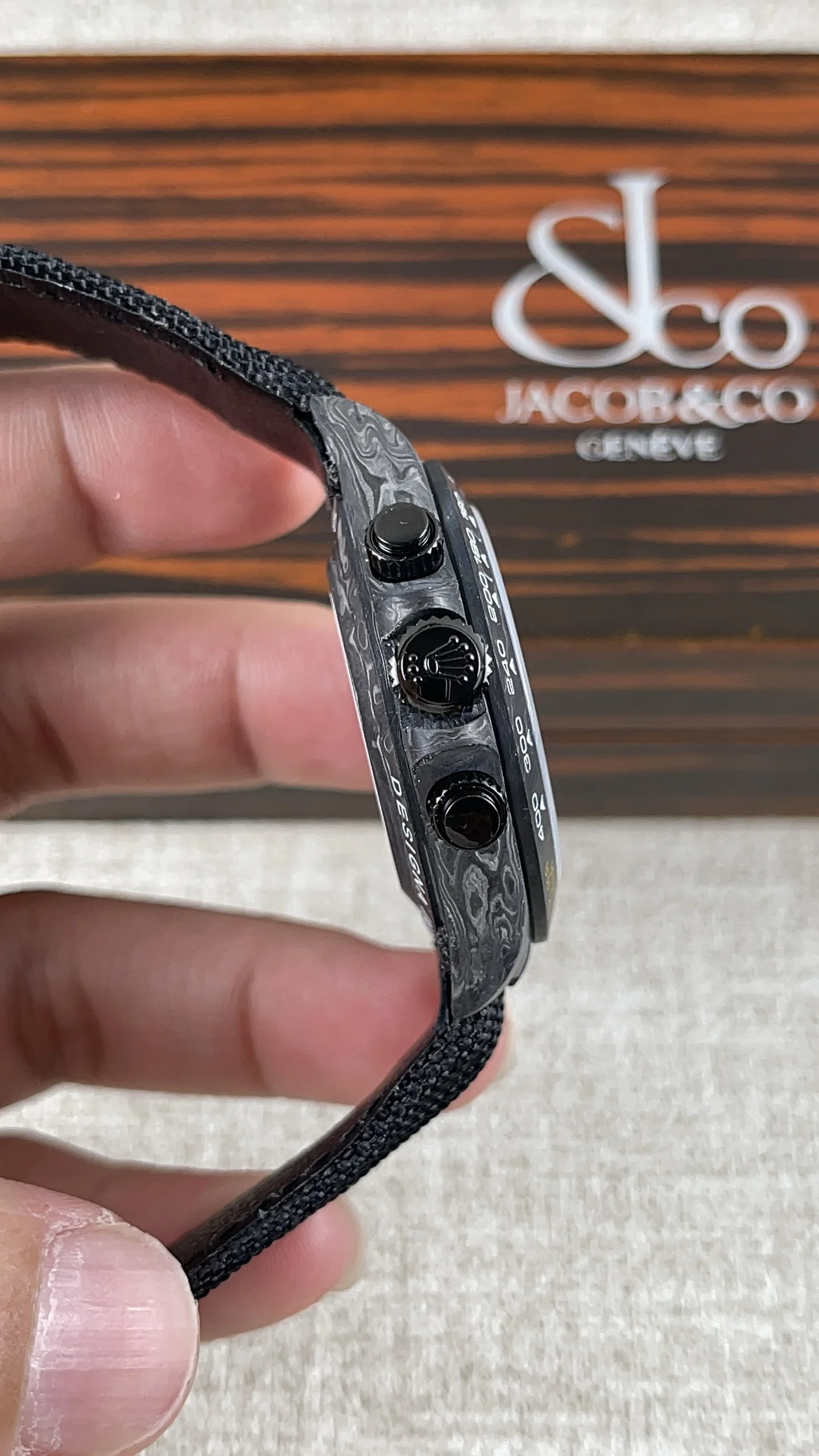 Rolex Daytona Carbon — photographed off the sweep