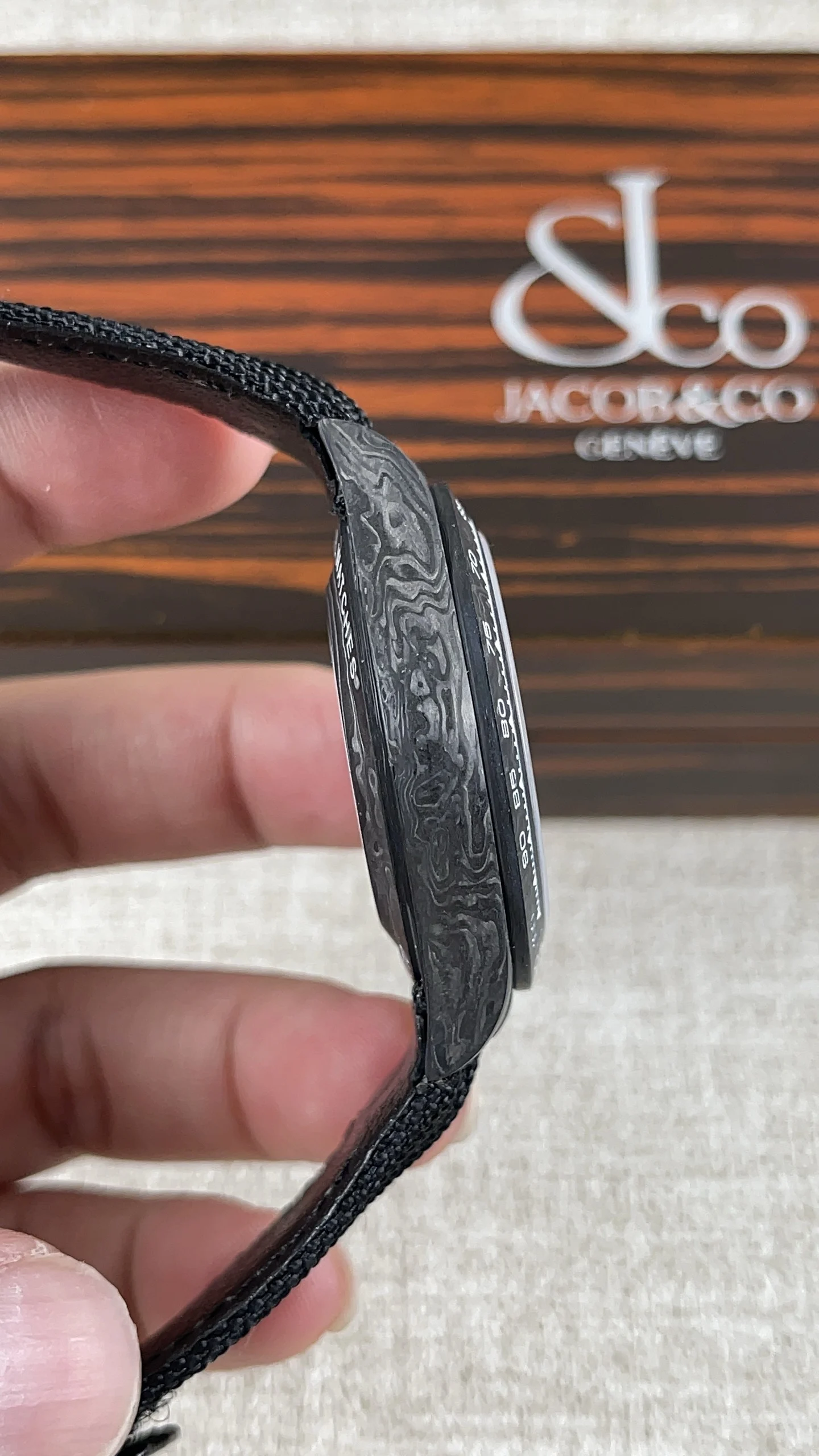 Rolex Daytona Carbon — photographed off the sweep