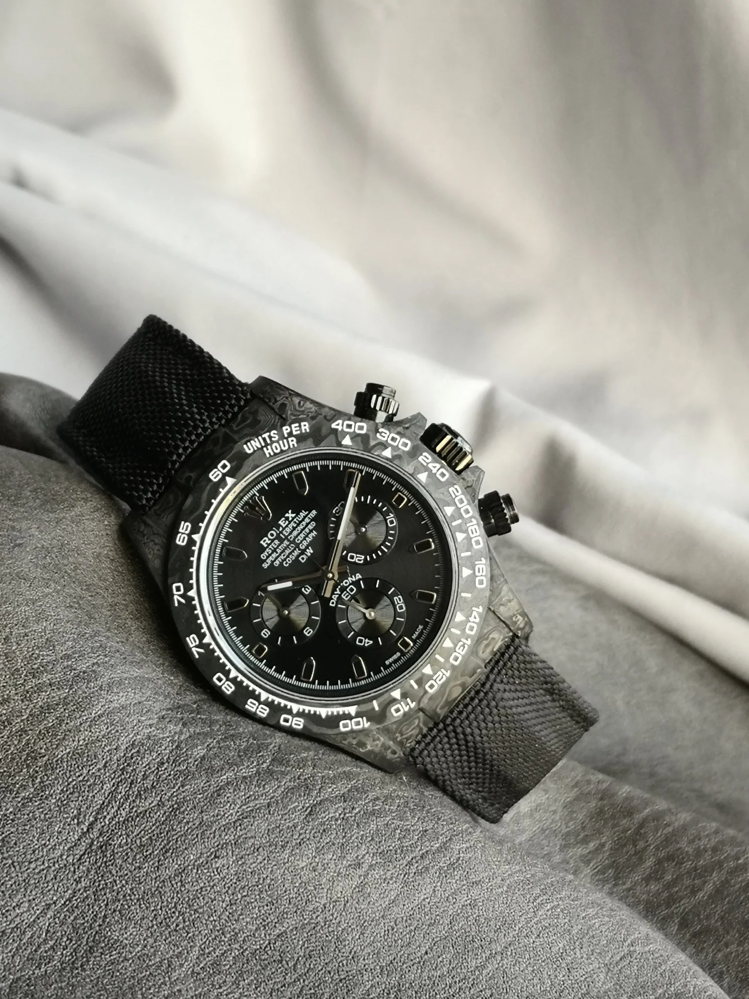 Rolex Daytona Carbon — photographed off the sweep