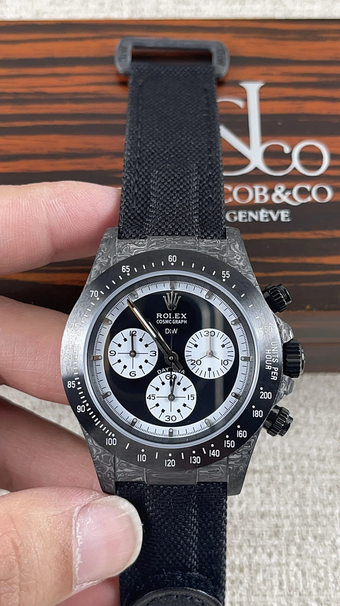 Rolex Daytona Carbon — photographed off the sweep
