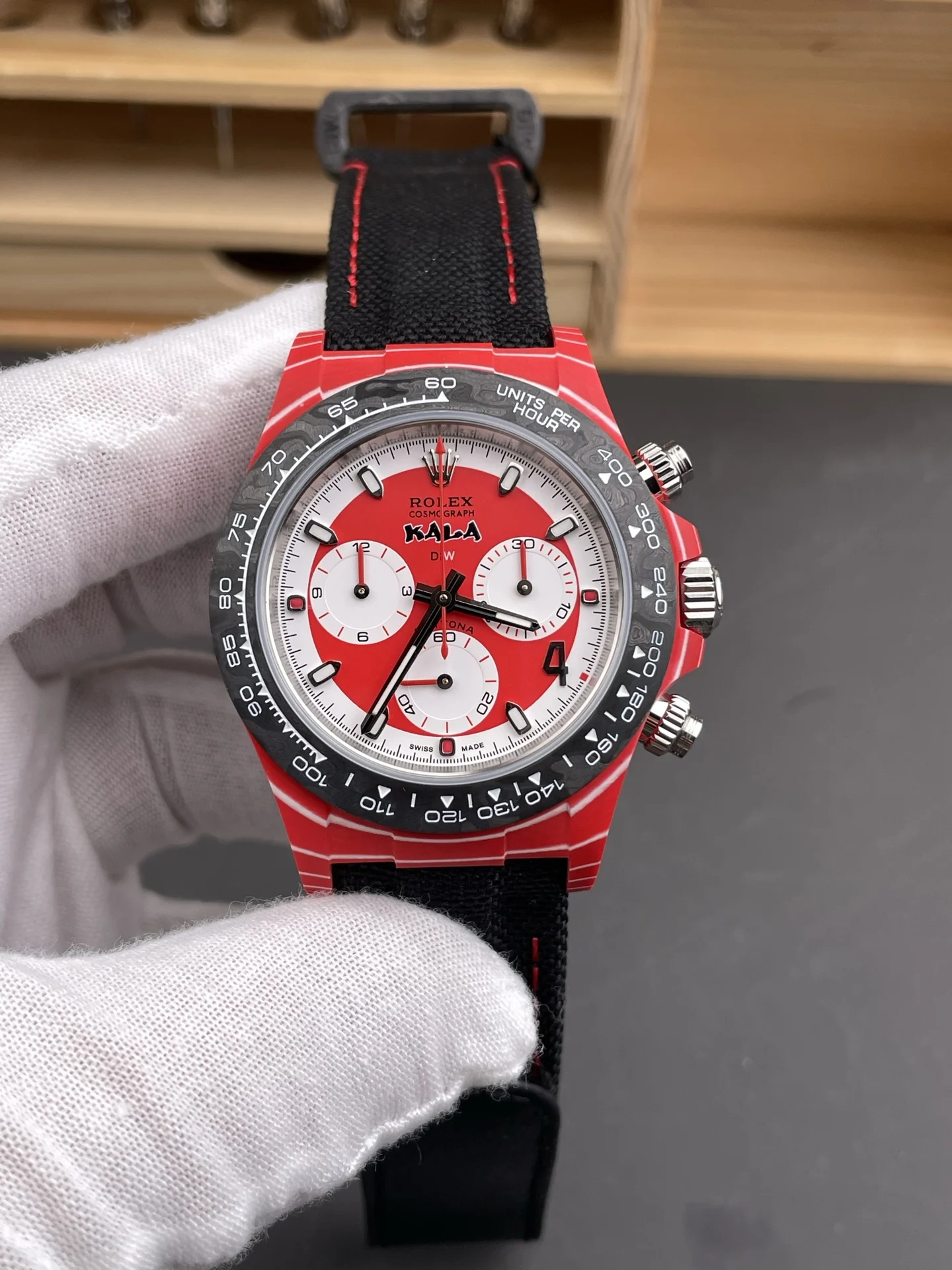 Rolex Daytona Carbon Red Dial — photographed off the sweep