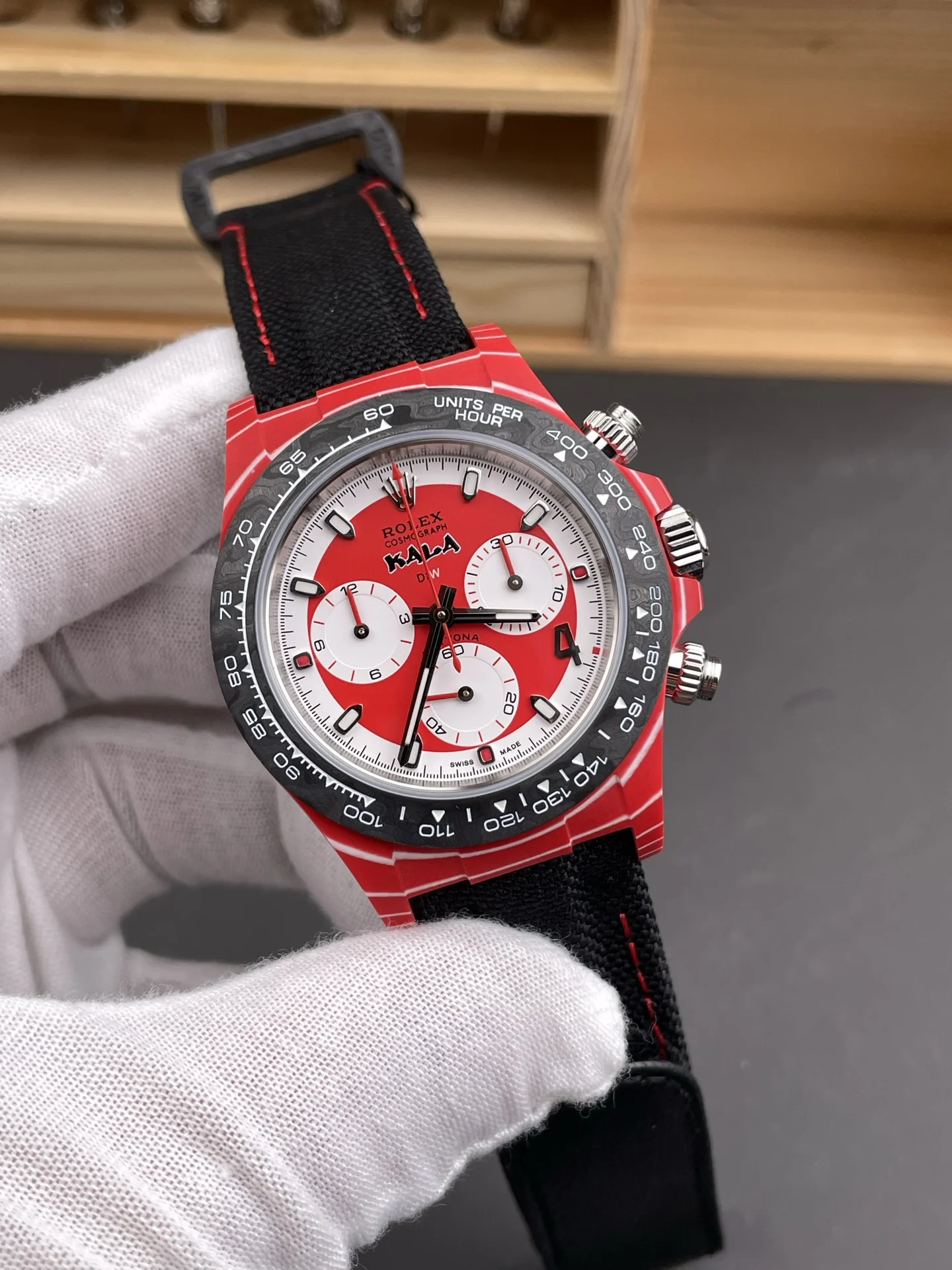 Rolex Daytona Carbon Red Dial — photographed off the sweep