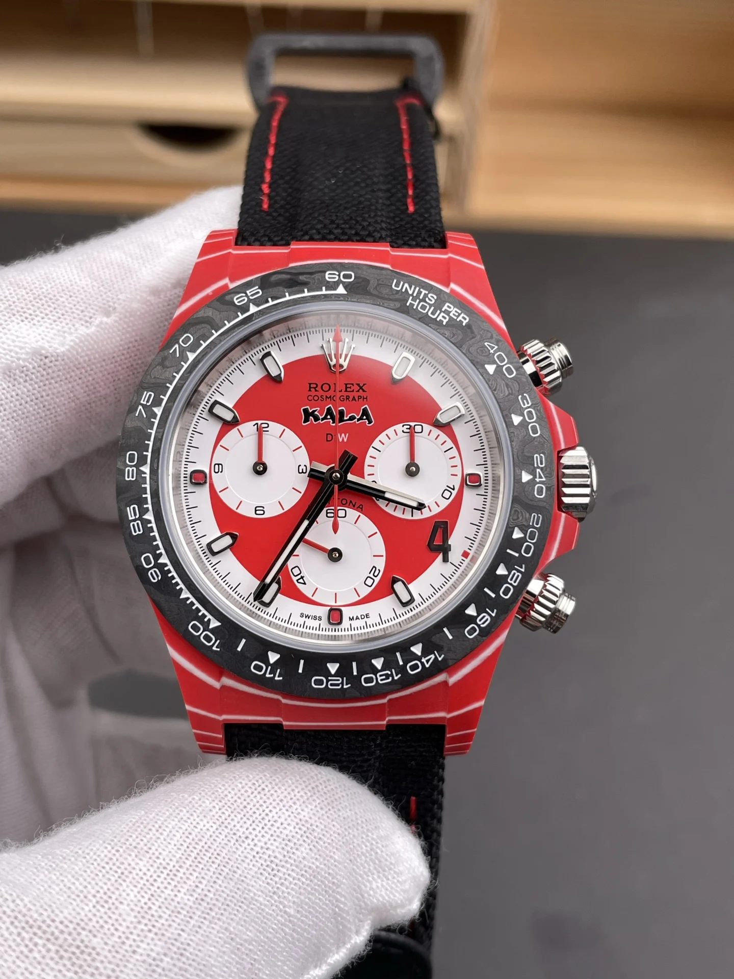 Rolex Daytona Carbon Red Dial — photographed off the sweep