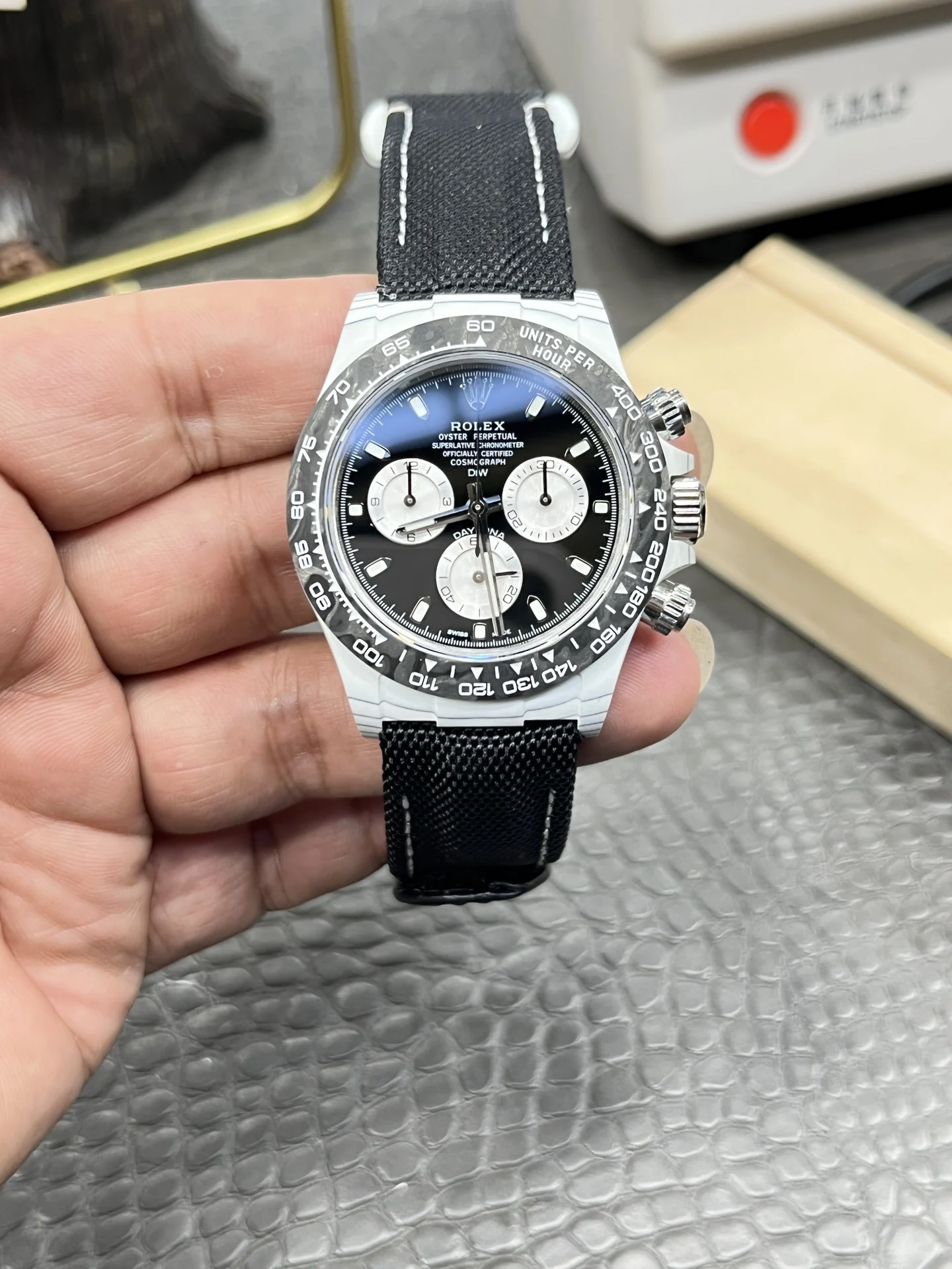 Rolex Daytona Panda Carbon — photographed off the sweep