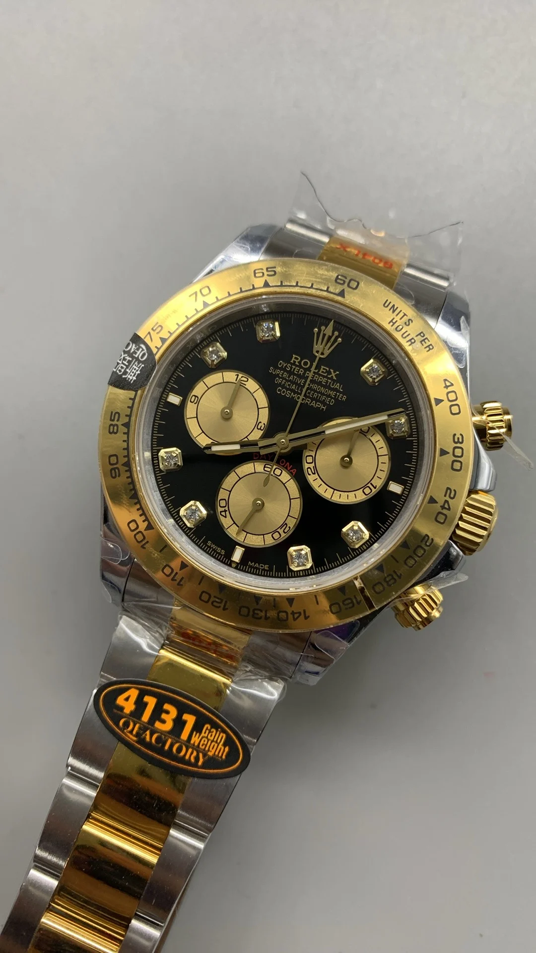 Rolex Daytona Two-Tone Black Dial Diamond-Set — photographed off the sweep