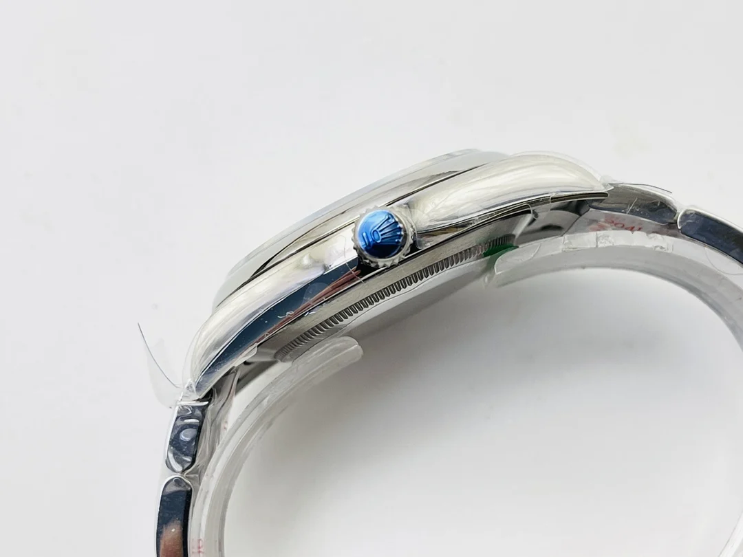 Rolex Oyster Perpetual 114300 — photographed off the sweep