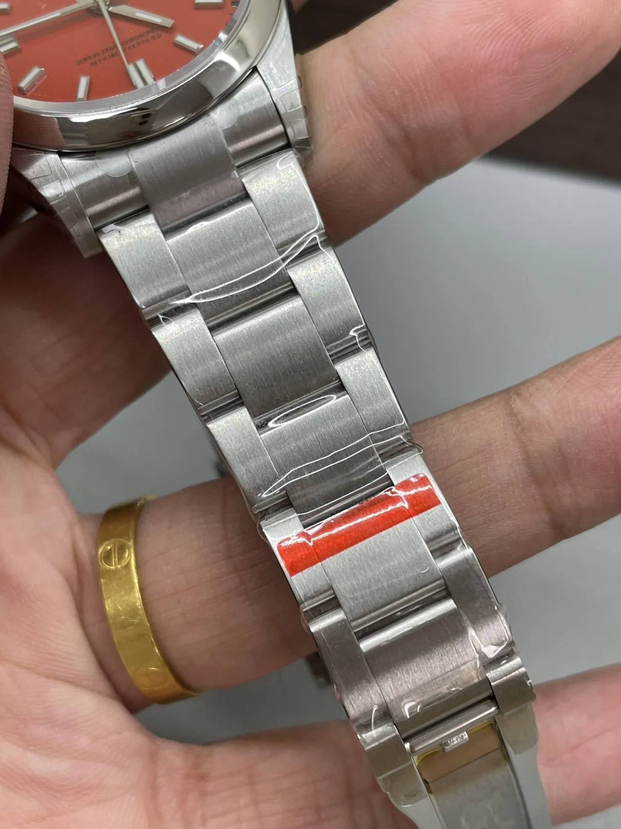 Rolex Oyster Perpetual Red Dial 36mm — photographed off the sweep